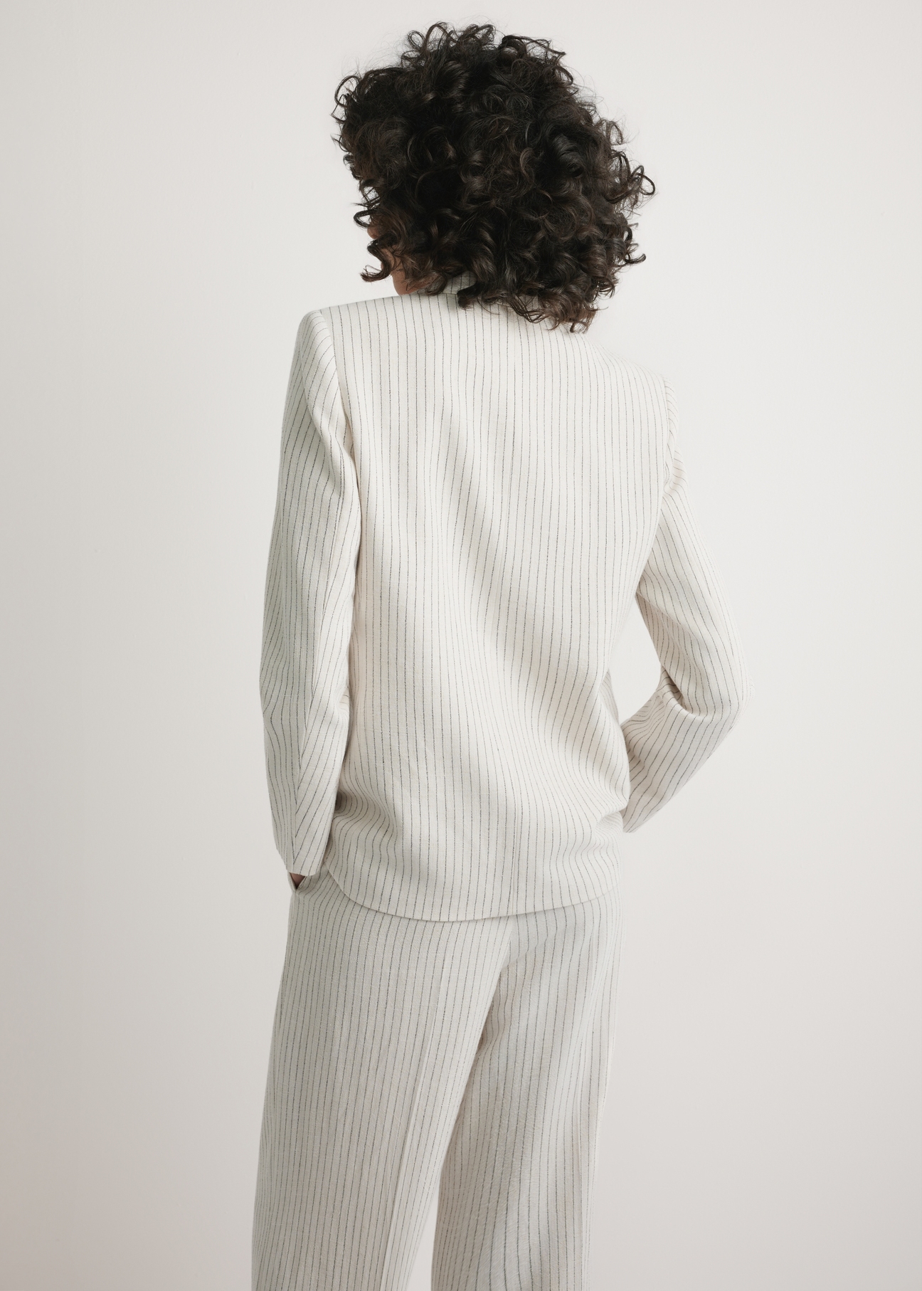 Women's striped blazer ZAKDT-0048-0P(W26) - back view of the product, on a model, against a light background. Half-length silhouette visible.