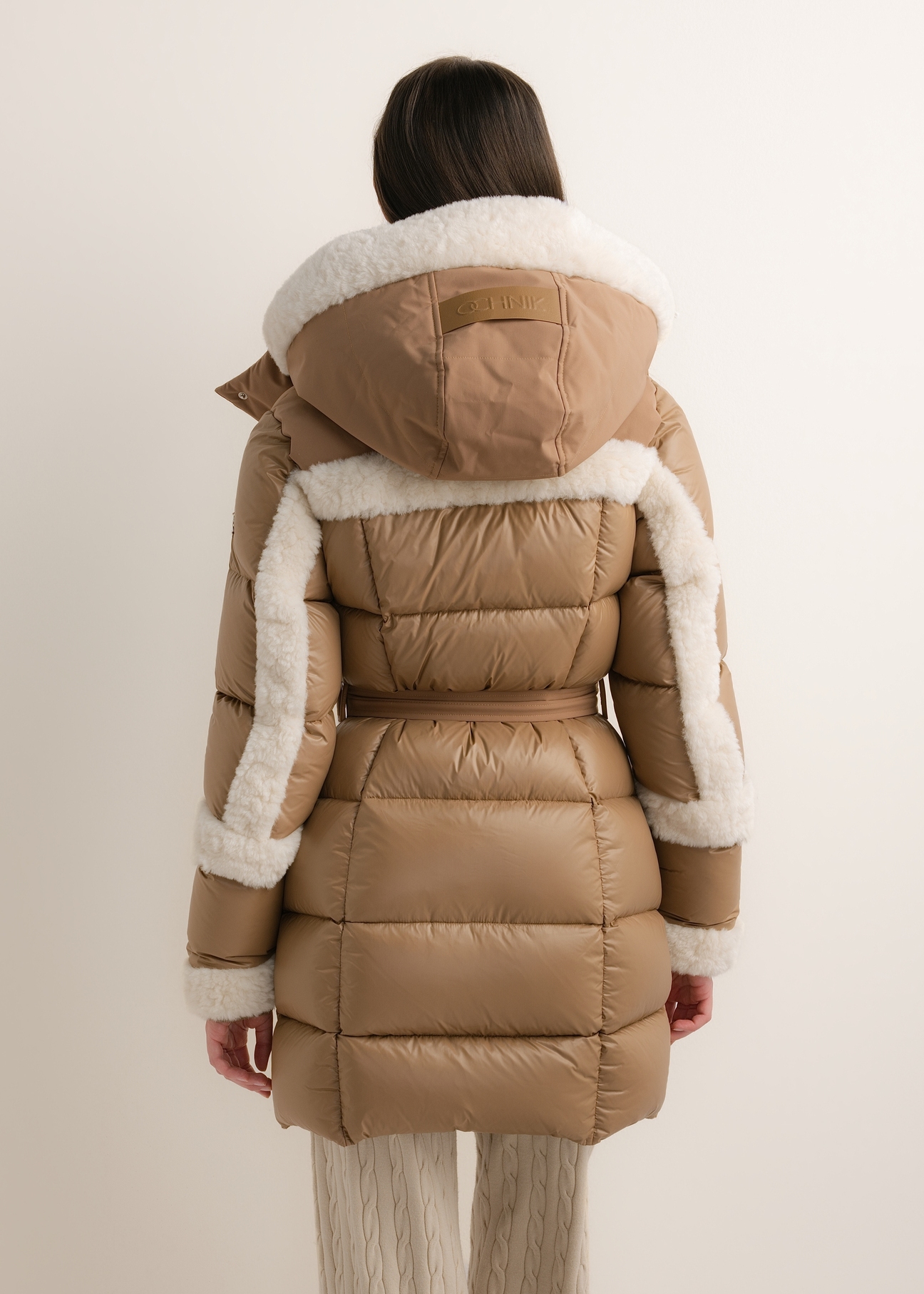 Beige women's winter jacket KURDT-0697-1B(Z26), back view on a model. Half-body shot.