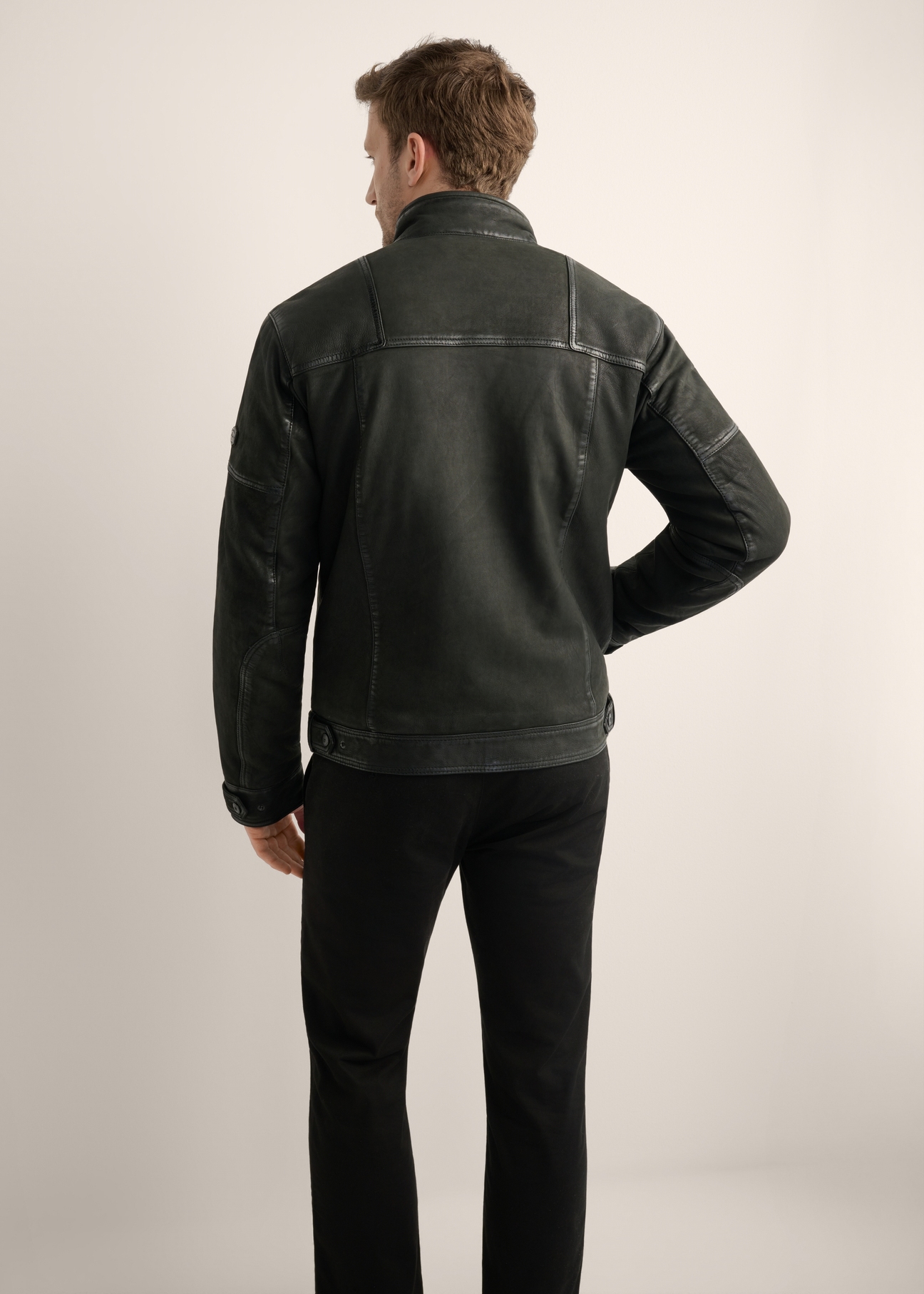 Black men's leather jacket KURMS-0420-99(Z26), product view from the back on the model. Half of the silhouette visible.