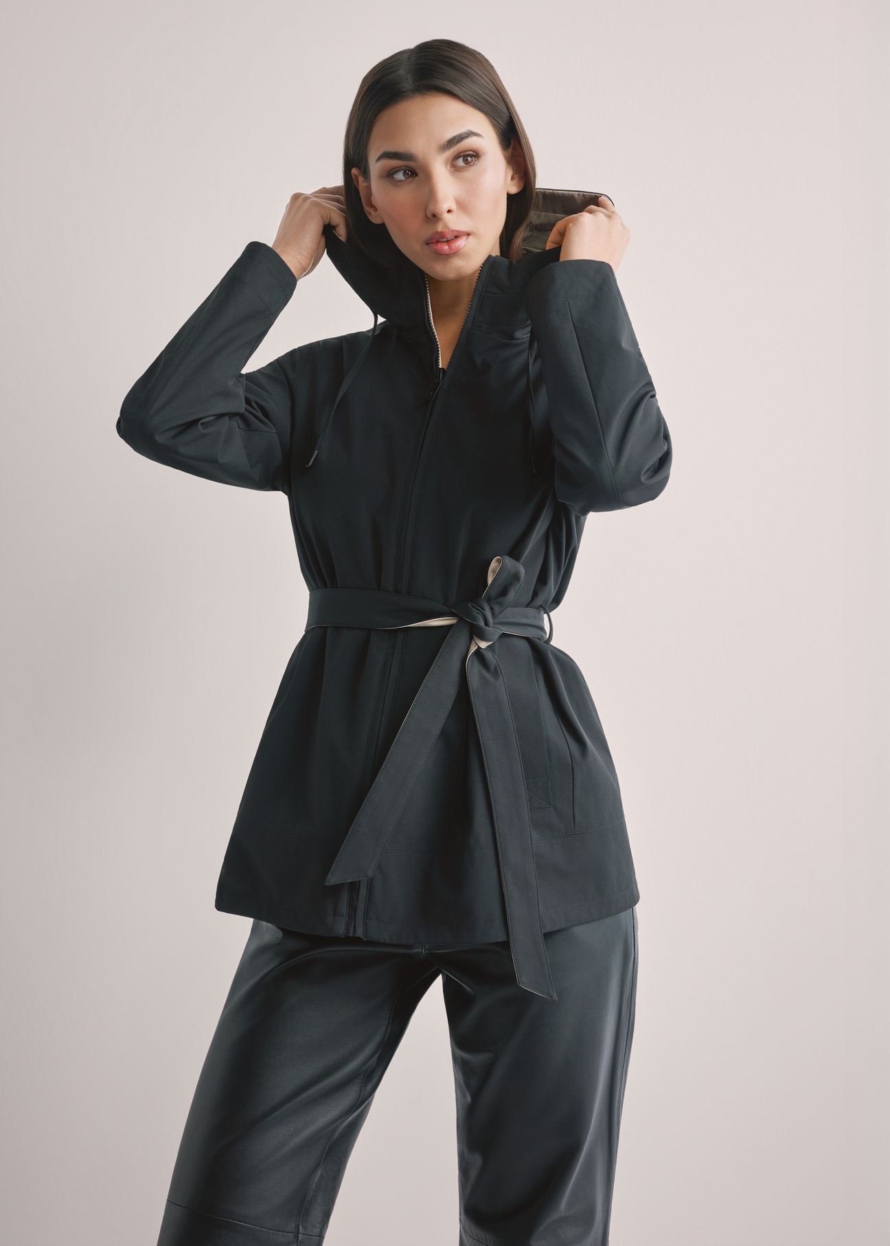 Women's reversible transitional jacket KURDT-0655-9J(W26), front view of the product on the model. Half of the silhouette visible.