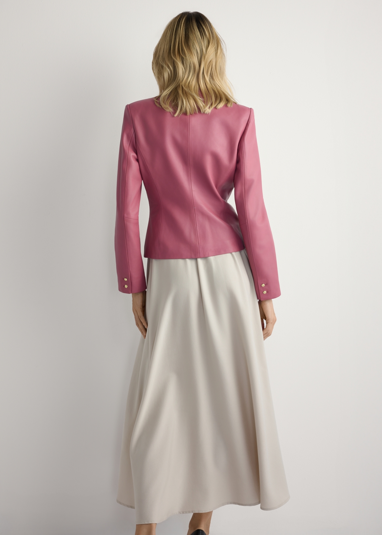 Women's pink leather jacket KURDS-0599-5D(W26) - back view of the product, on a model, against a light background. Full body visible.