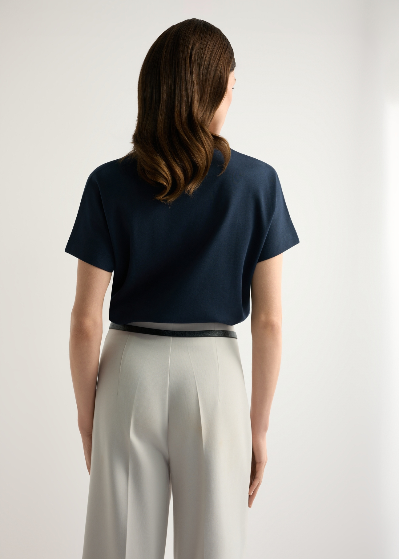 Navy blue women's mercerized cotton T-shirt TSHDT-0154-7E(W26) - back view of the product, on a model, against a light background. Knee-length silhouette visible.