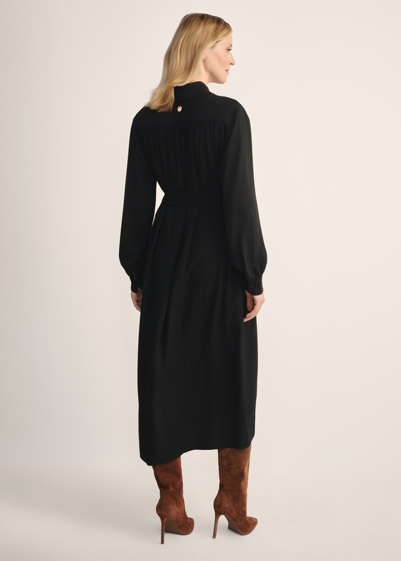 Women's black long-sleeved dress SUKDT-0246-99(Z25), back view of the product on the model. Full body visible.