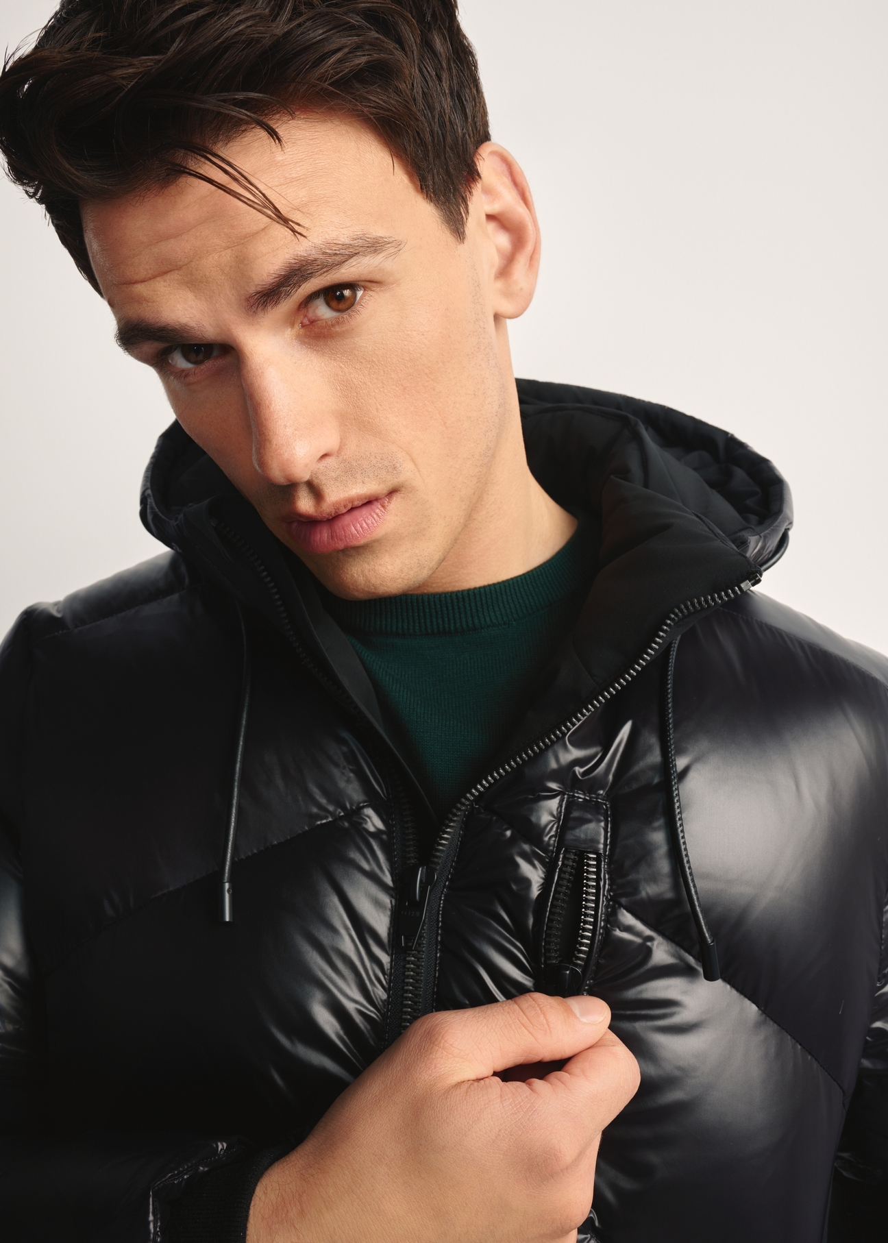 Black men's jacket with natural insulation KURMT-0393-99(Z25) - product view on model, on white background. Close-up of detail.