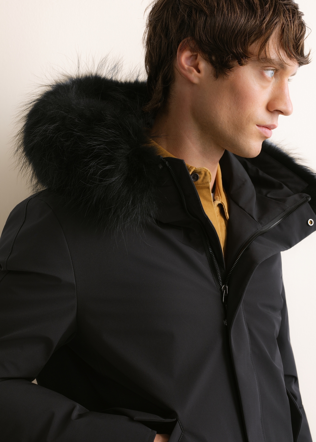 Men's black winter jacket KURMT-0446-99(Z26); close-up of the product on a model against a light background.