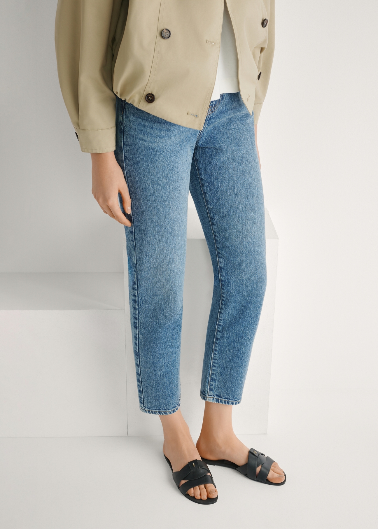 Women's black braided flip-flops BUTYD-0903C-99(W26), front view of the product on the model's feet.