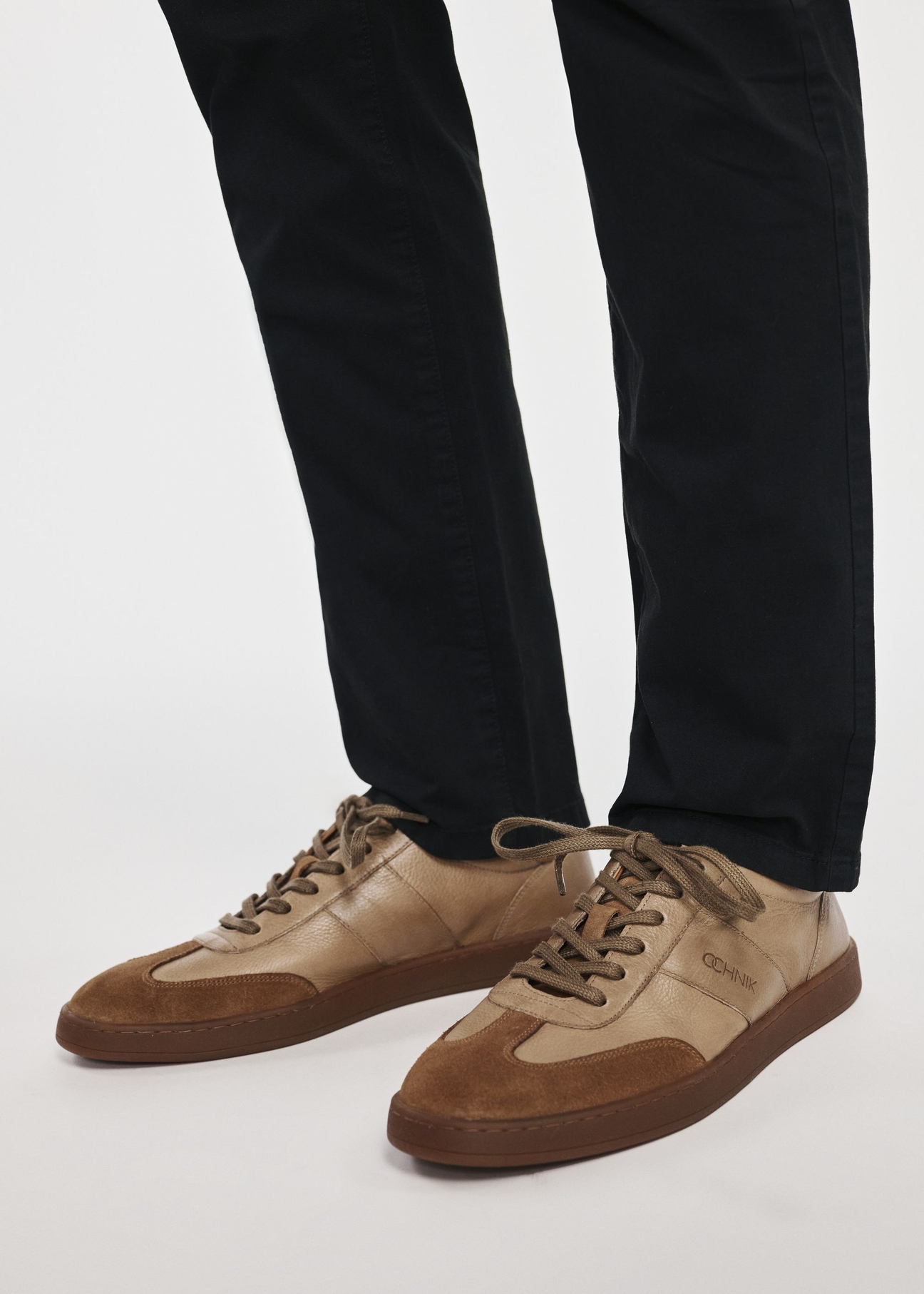 Men's leather sports shoes BUTYM-0487-1B(W26), product view on model's feet, on light background.