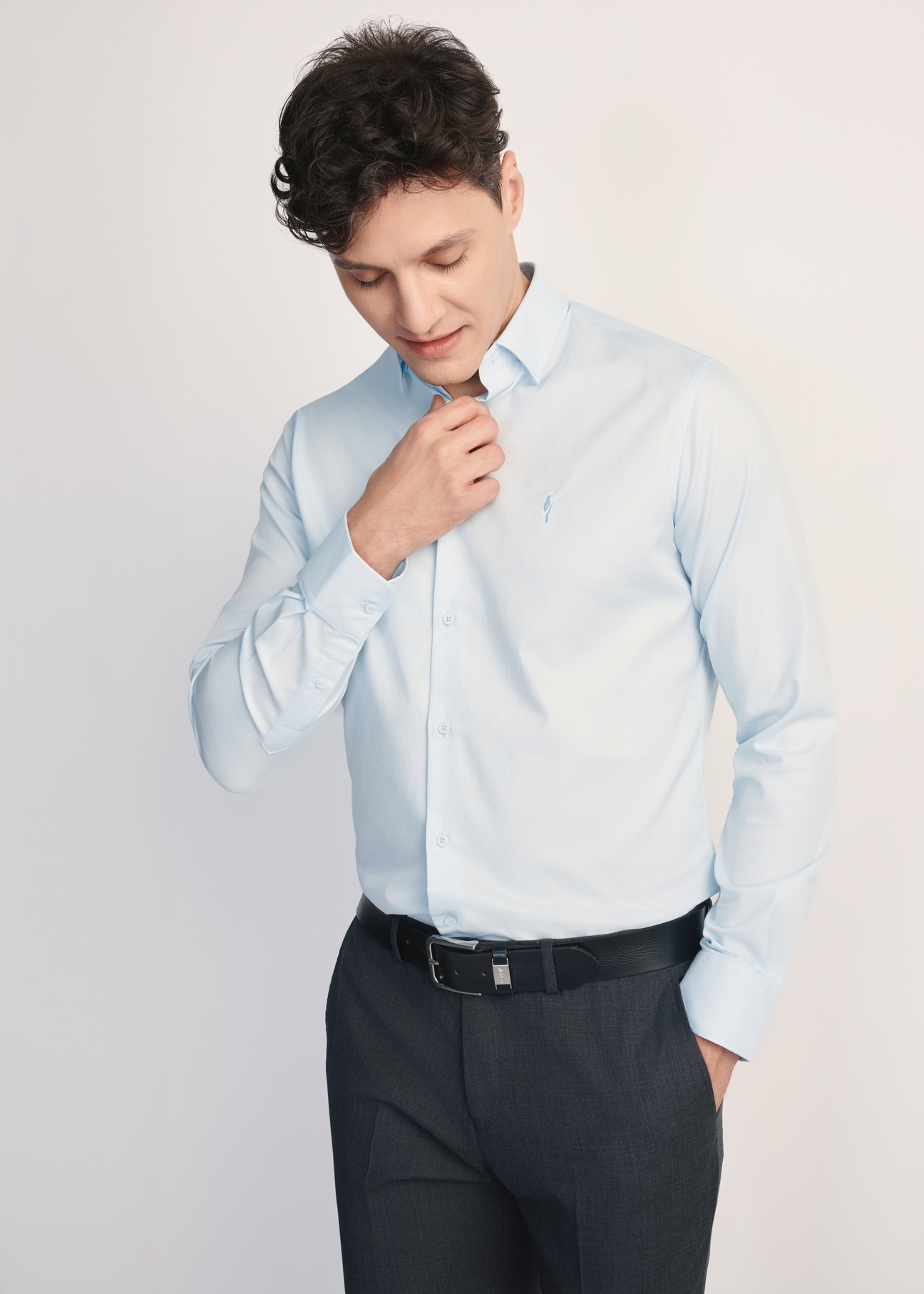 Blue men's shirt KOSMT-0351-62(Z25) - front view of the product on a model on a white background. Half of the silhouette visible.