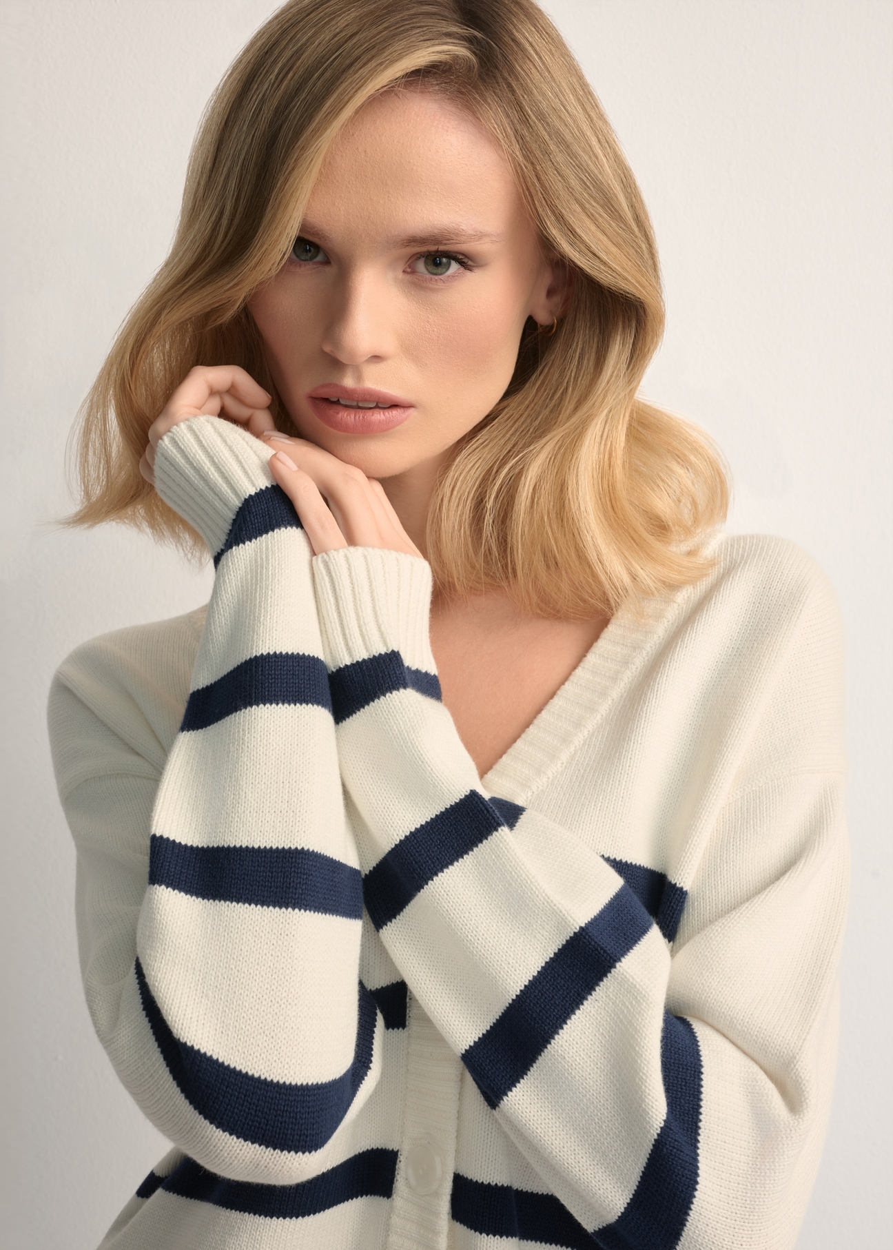 Cream women's striped cardigan KARDT-0060-0P(W26), close-up of the product detail on the model.