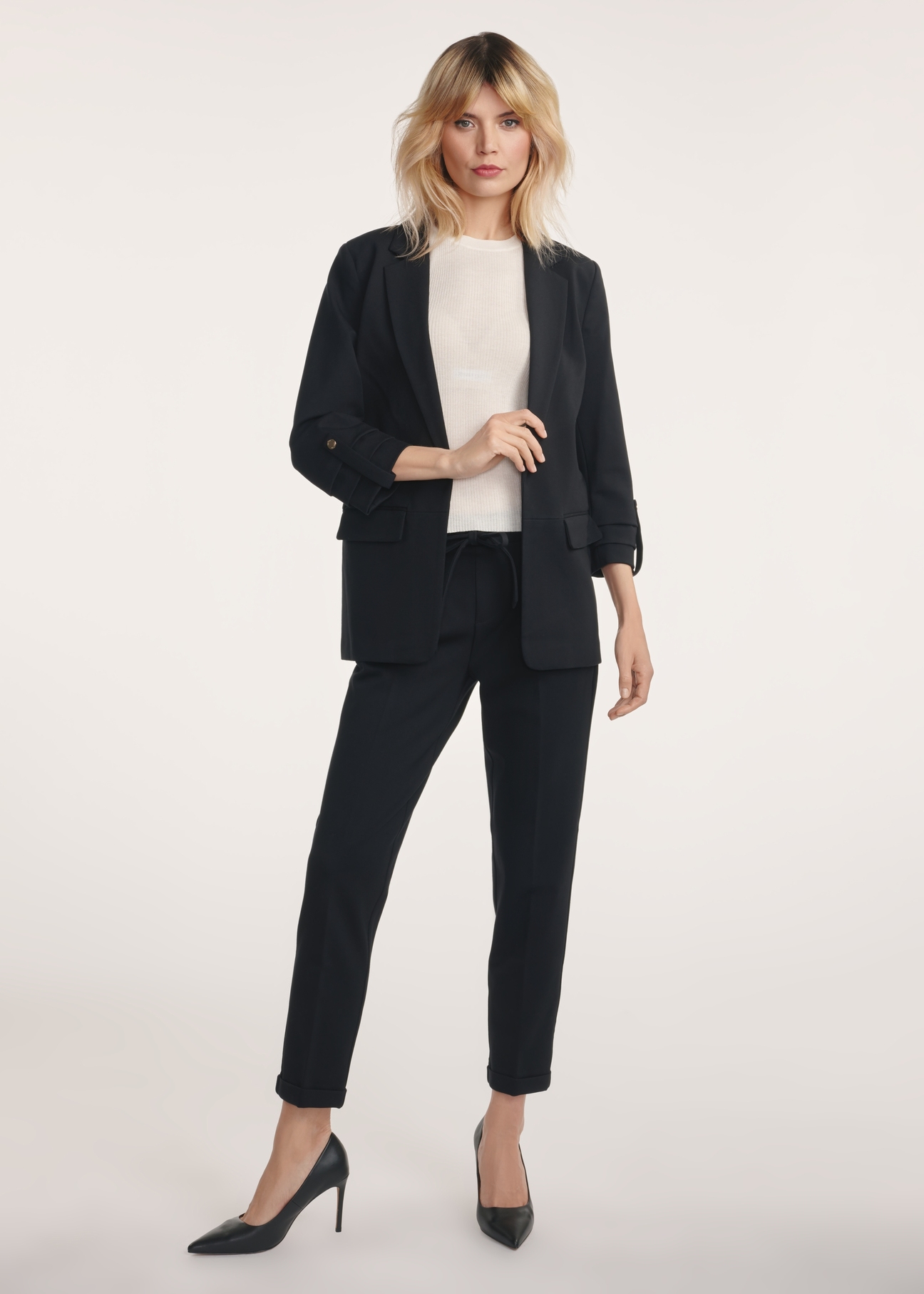 Black women's trousers with a crease SPODT-0098-99(Z24), product view from the front on the model, the entire silhouette is visible.