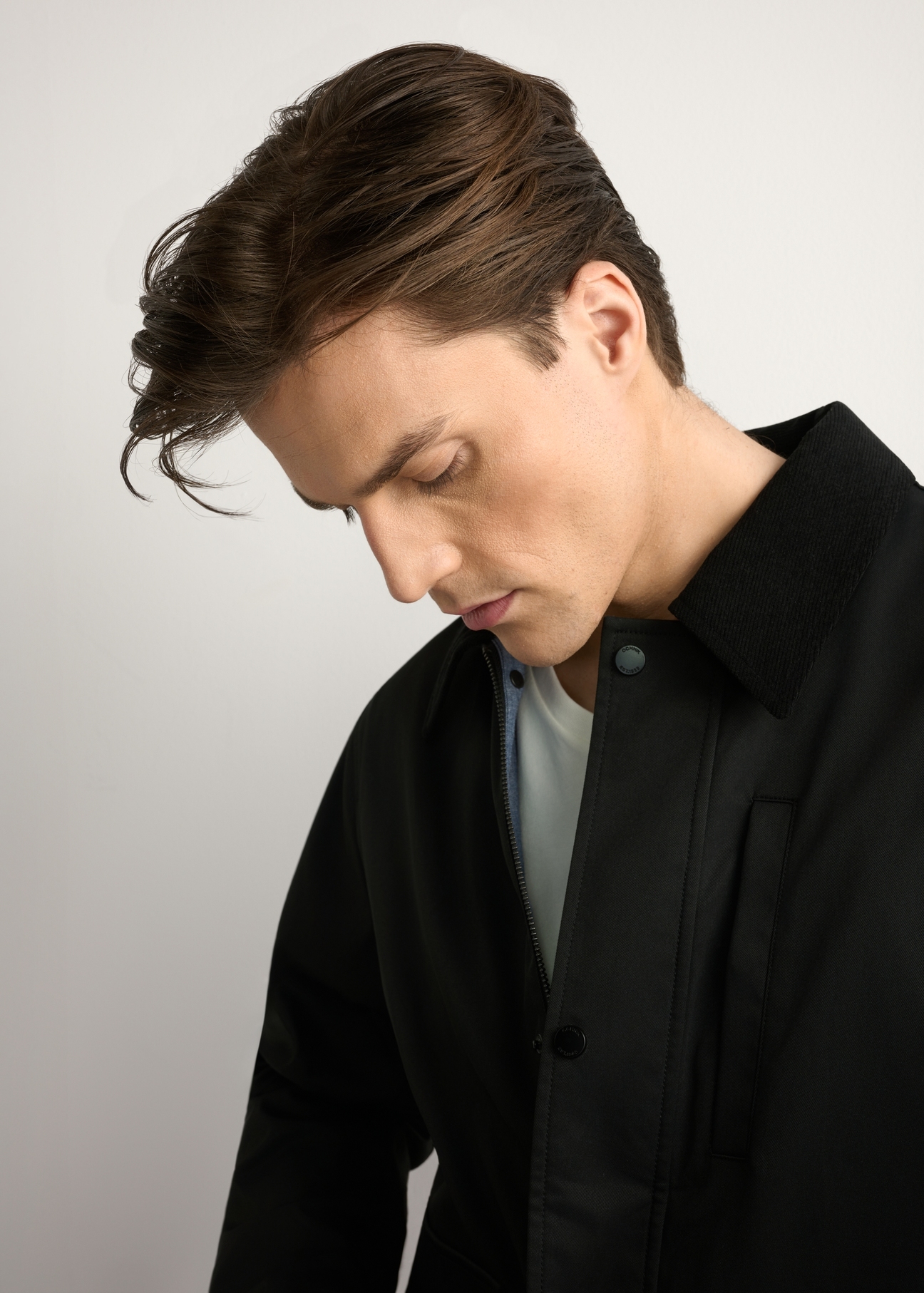 Black men's transitional jacket KURMT-0419-99(W26) - close-up of detail, on a light background.