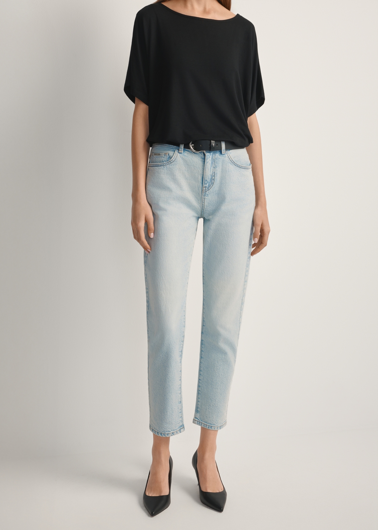 Light blue women's jeans JEADT-0011-7A(W26), front view of the product on the model. Half of the silhouette visible.