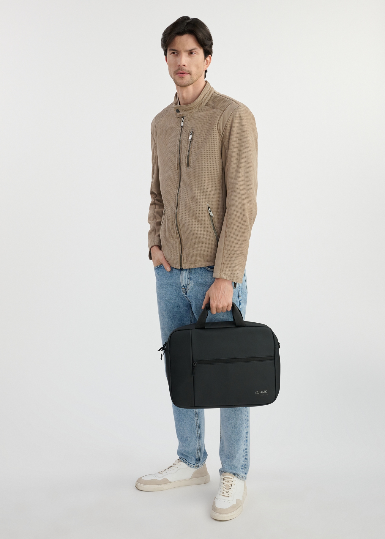 Black men's laptop bag TORMN-0343-99(W25), front product view on the model. Full body visible.