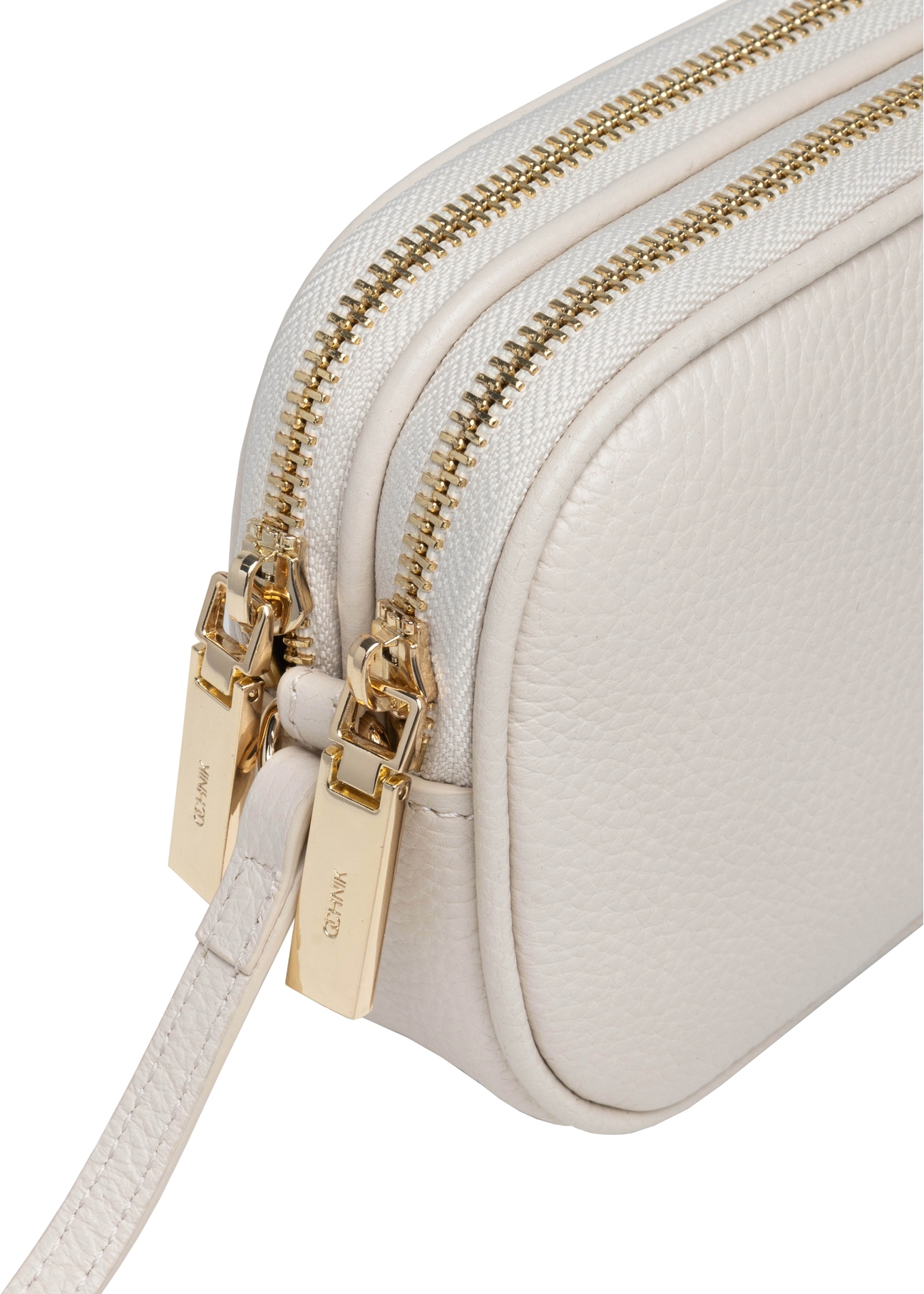 Small cream-colored leather women's handbag TORES-1152-0B(W26), close-up of the product detail, view on a white background.