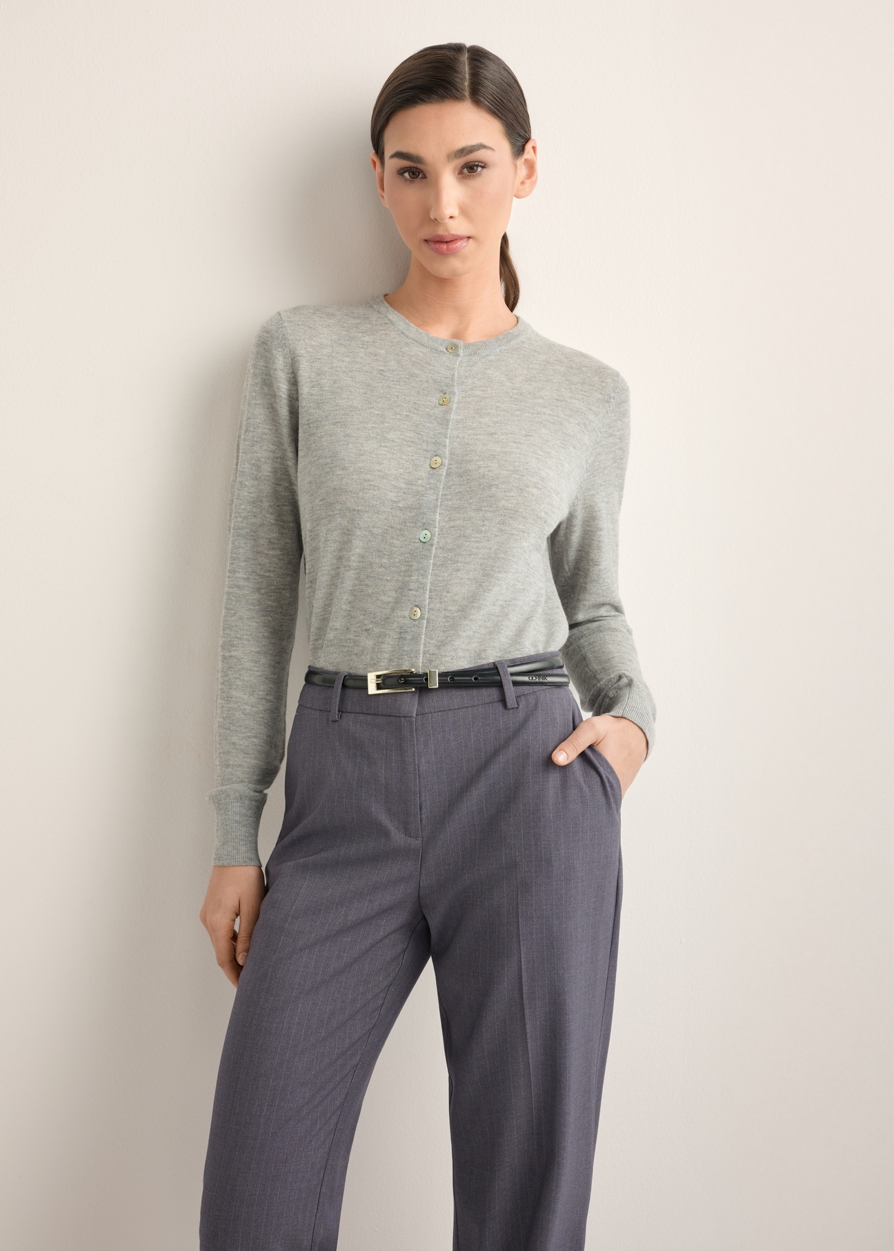 Women's wool cardigan in gray KARDT-0065-9B(Z26), front view of the product on the model. Half of the silhouette visible.