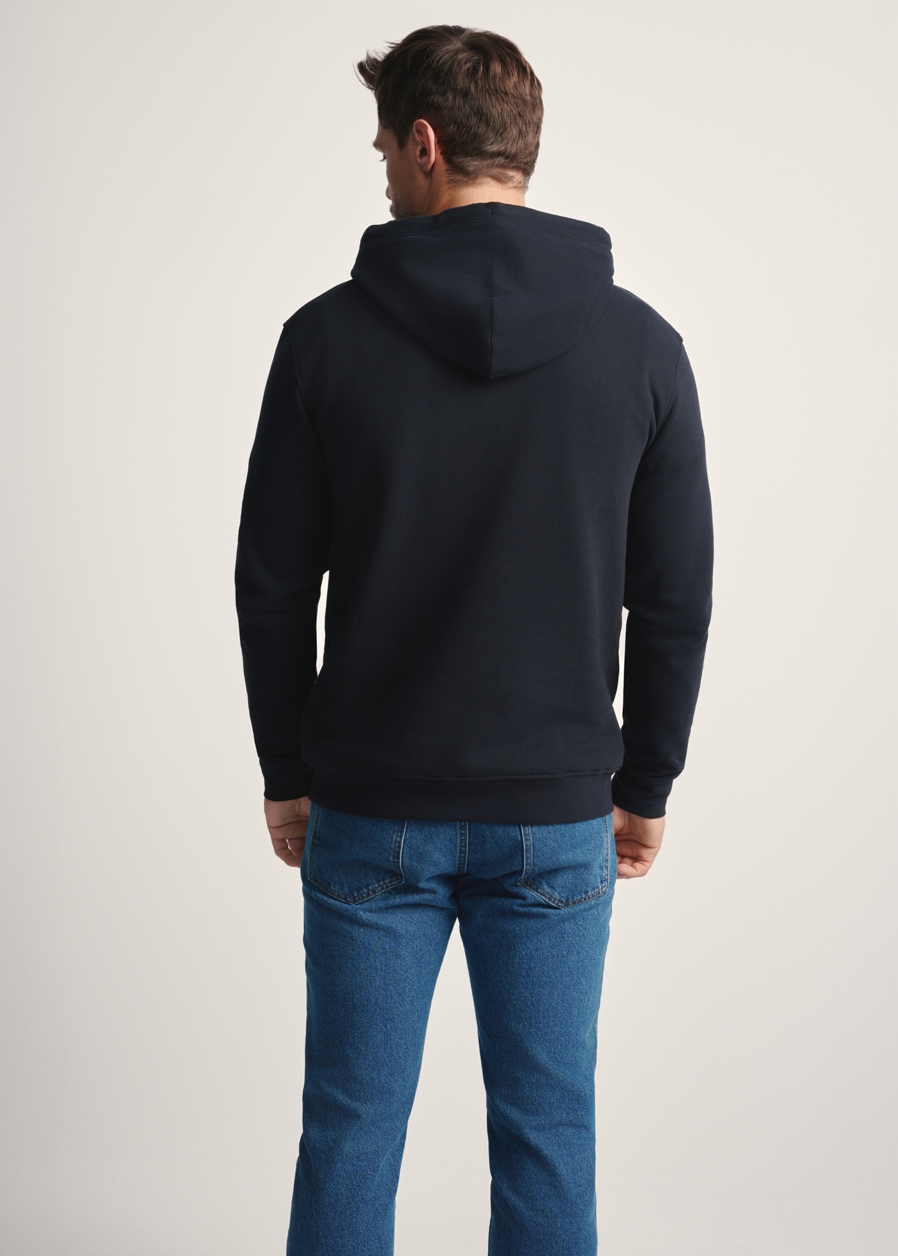 Men's black hoodie BLZMT-0073-99(Z25), back view of the product on the model. Half of the silhouette visible.