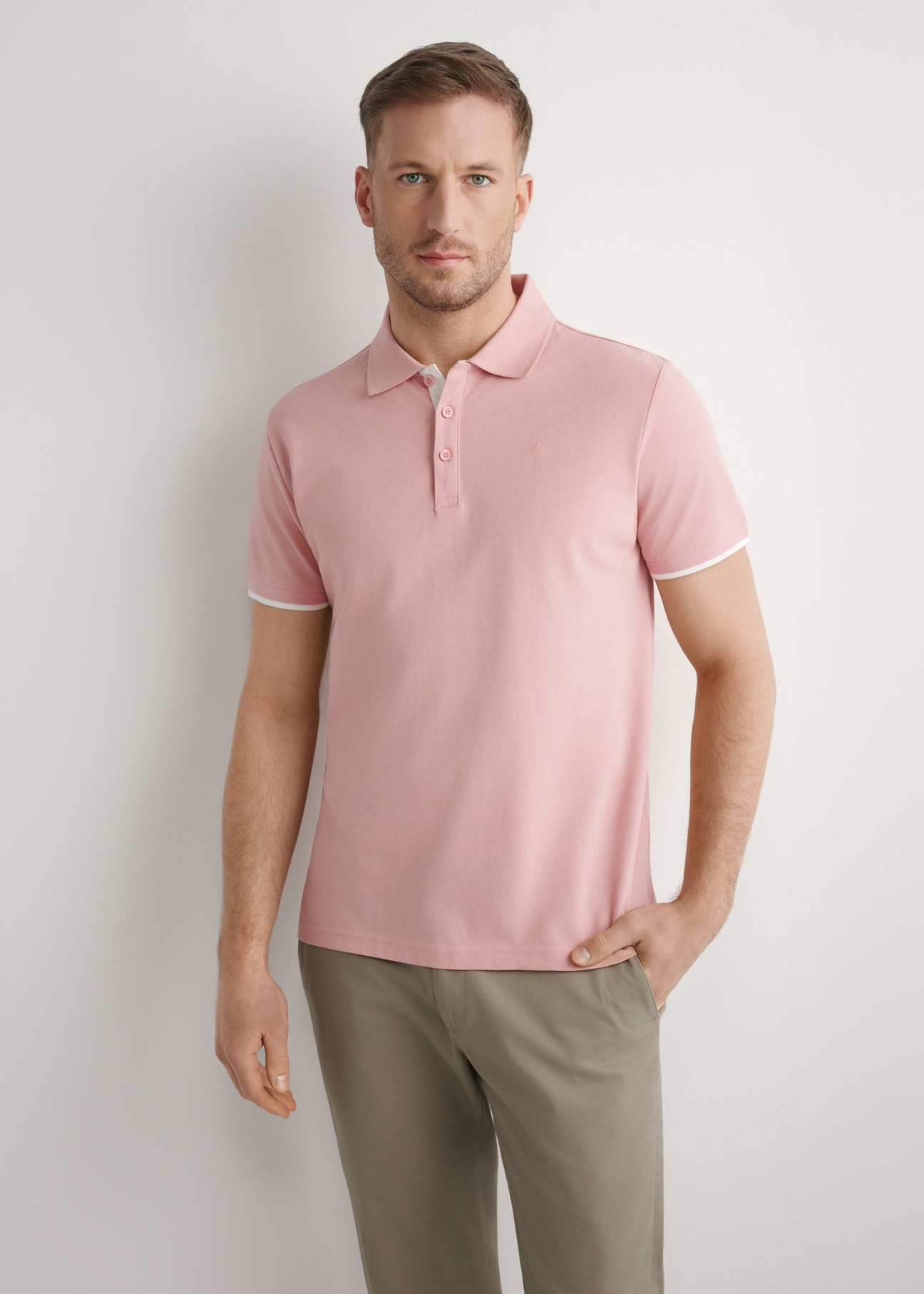 Pink cotton polo shirt POLMT-0045B-5B(W26), front view of the product on the model. Half of the silhouette visible.