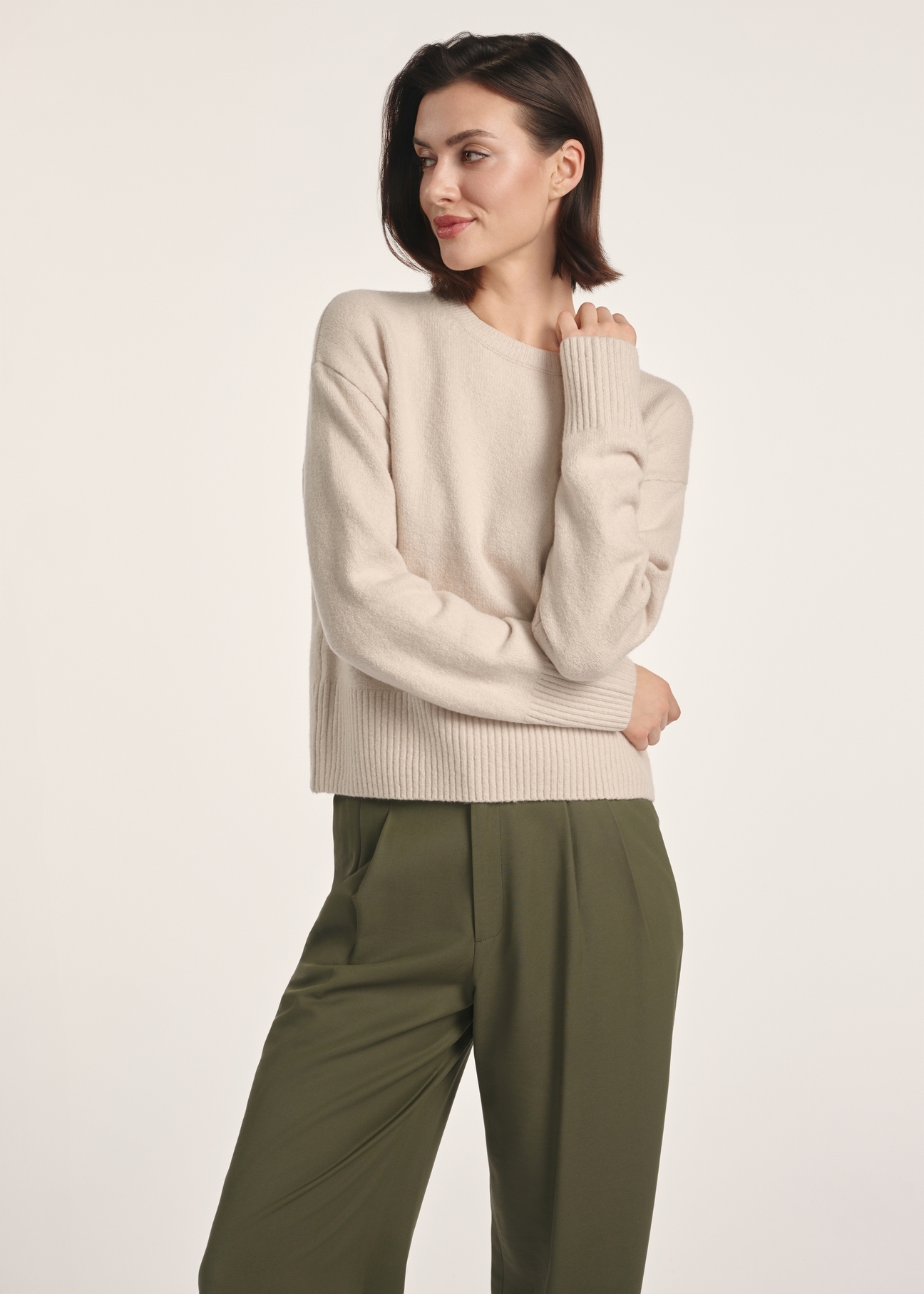 Beige women's sweater SWEDT-0242-80(Z25), front view of the product on the model. Half of the silhouette visible.