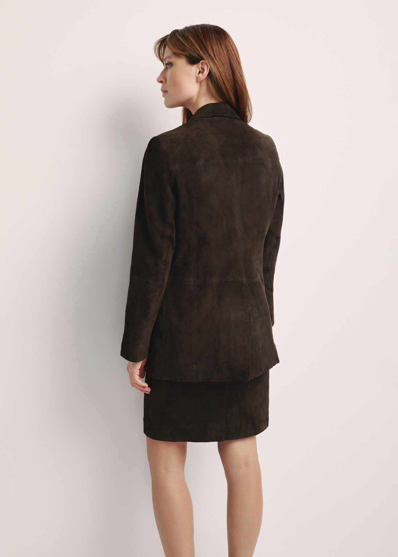 Brown women's suede jacket KURDS-0521-2880(Z25), product view from the back on the model, half of the silhouette visible.