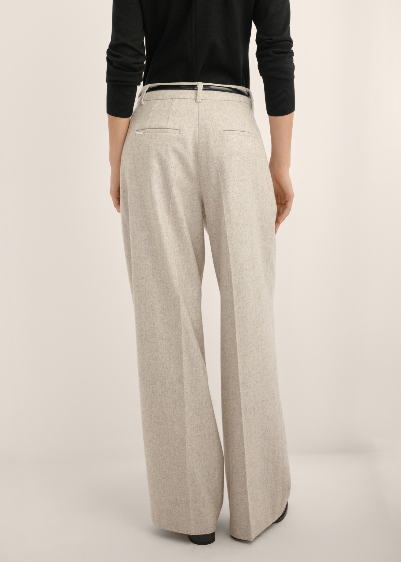 Light beige women's wool trousers SPODT-0133-1A(Z26), back view of the product on the model. Half of the silhouette visible.
