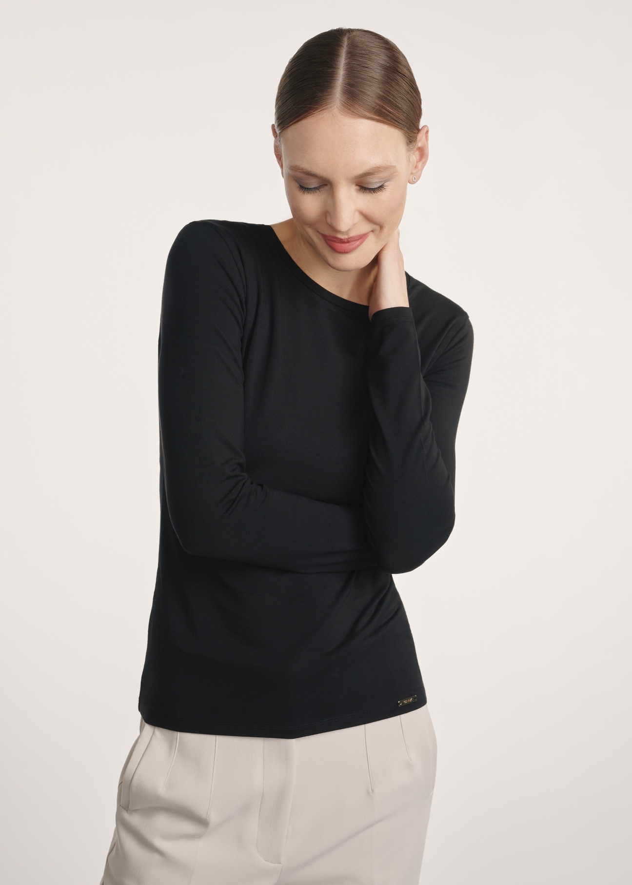 Black women's blouse LSLDT-0055-99(Z25), product visible from the front on the model, half of the silhouette visible.