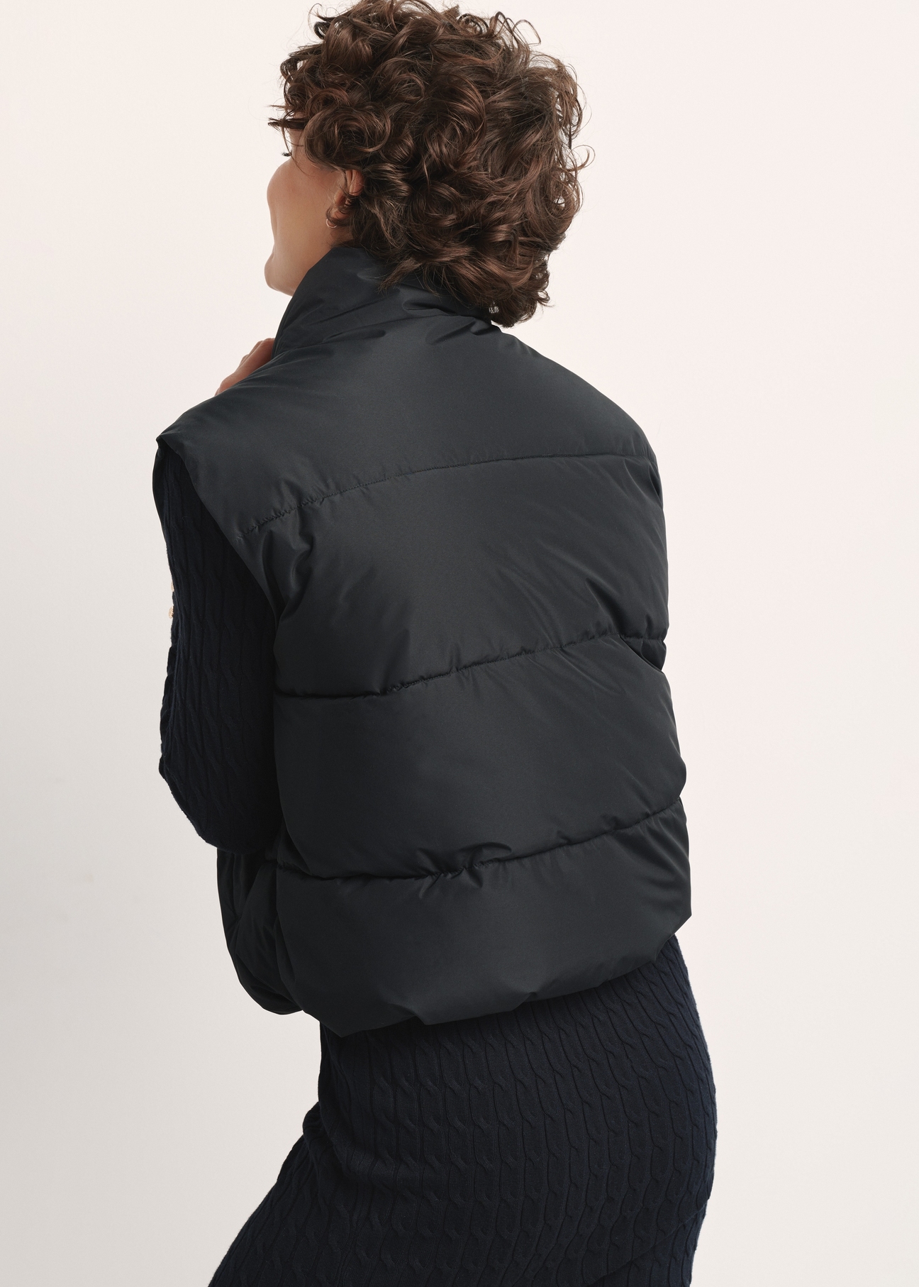 Black women's vest KAMDT-0033-99(Z25), product view from the back on the model. Half of the silhouette visible.