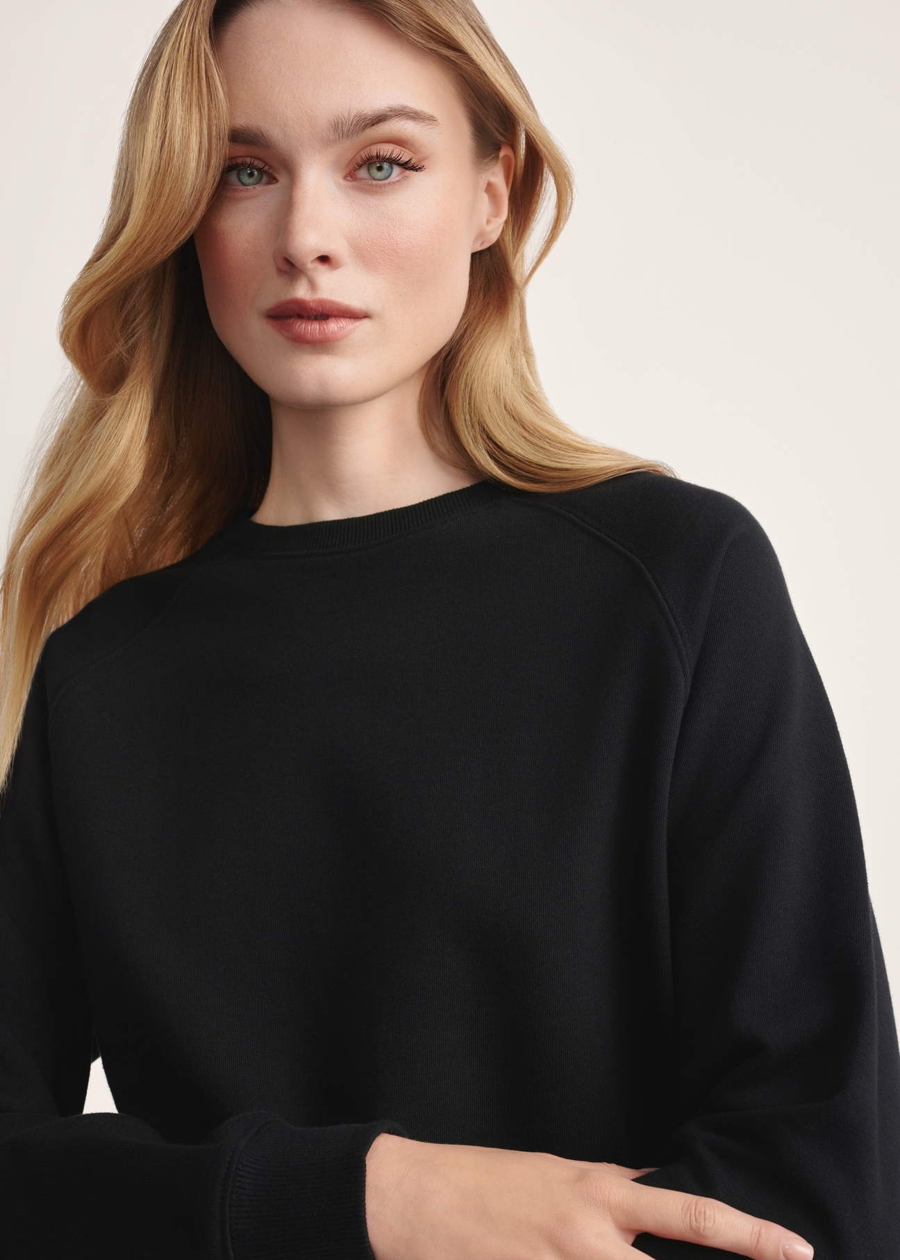 Black women's sweatshirt BLZDT-0114-99(Z25), product visible from the front on the model, close-up of the product detail.