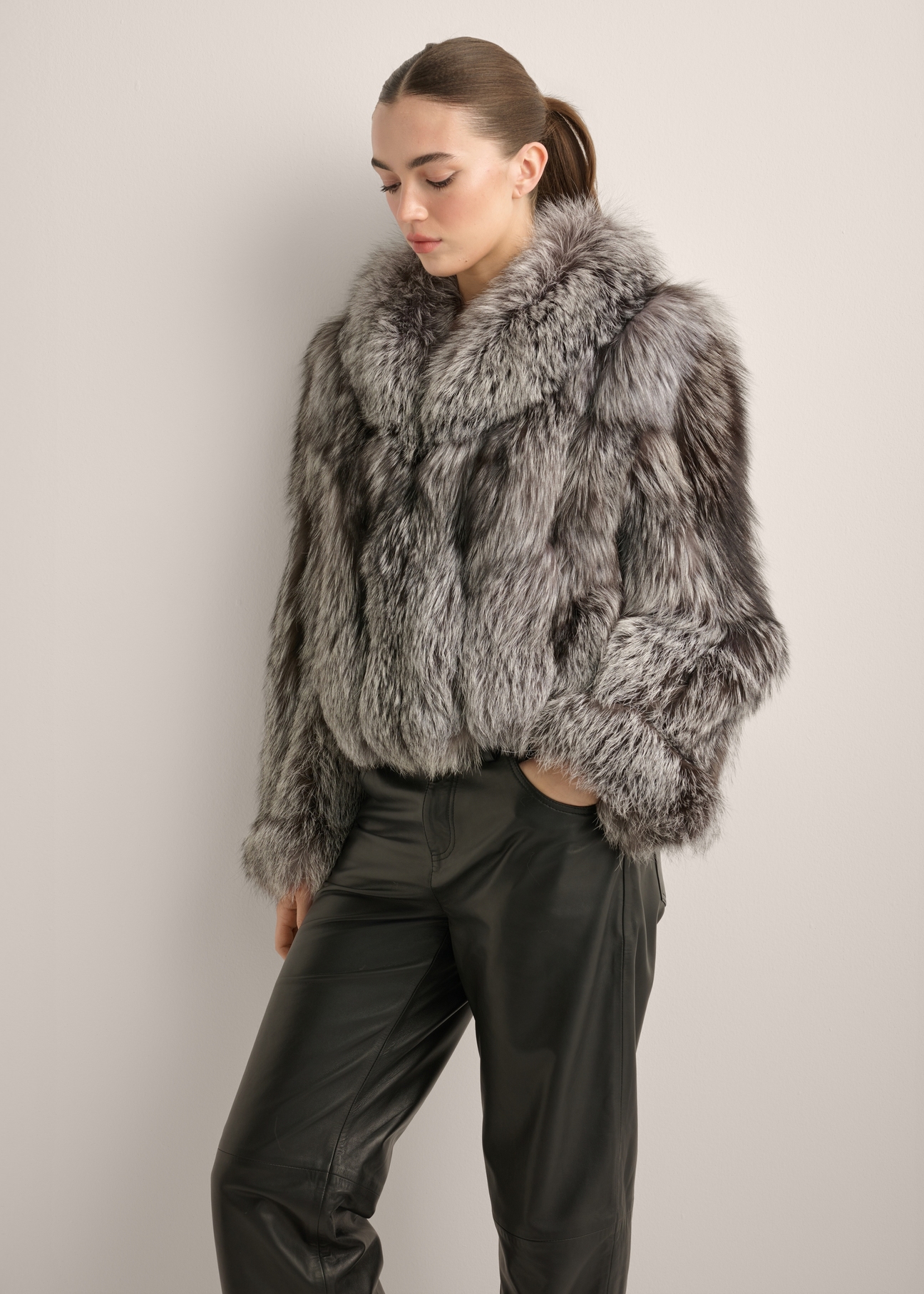 Women's natural gray fur coat FUTDF-0110-9B(Z26), diagonal view of the product on the model. Half of the silhouette visible.