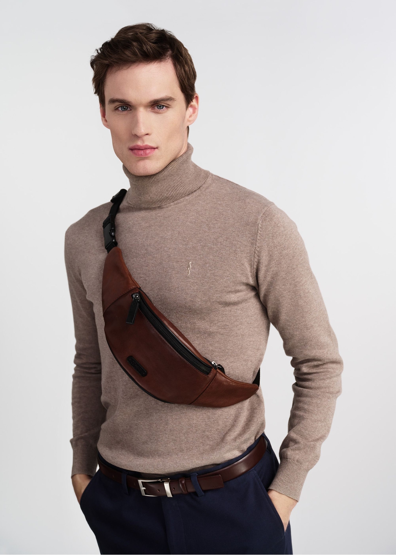 Men's brown leather waist bag TORMS-0107-1H(W26), product view on a model's silhouette, on a light background.