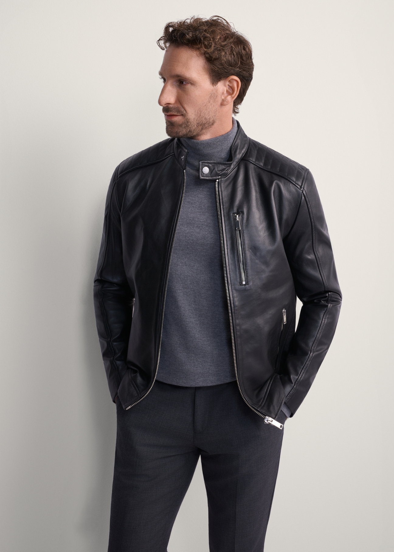Men's leather jacket with stand-up collar KURMS-0191-5491(KS), front product view on model. Half silhouette visible.