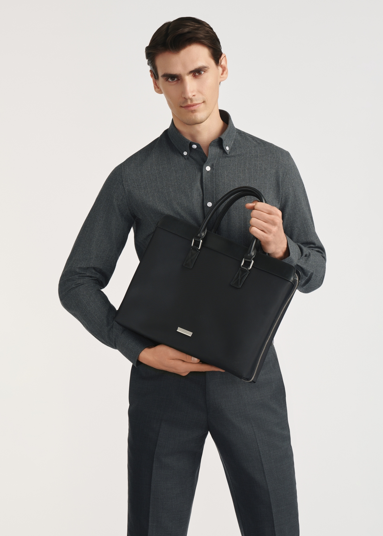 Black men's briefcase TORMN-0375-99(Z25) - front view of the product on a white background. Half of the silhouette visible.