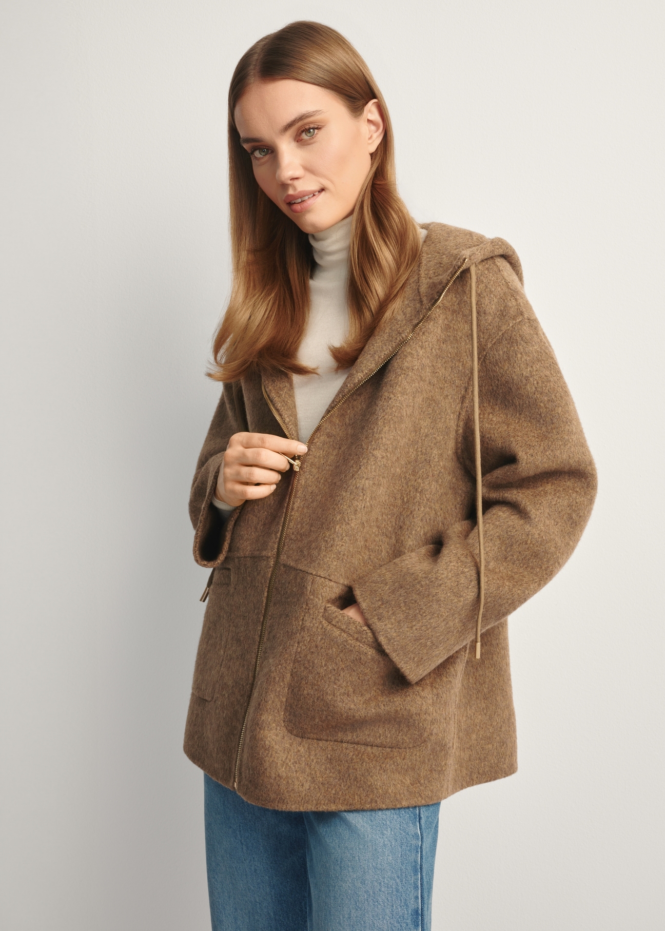 Brown woolen women's coat with hood PLADT-0064-89(Z25), front view of the product on the model, half of the silhouette visible.