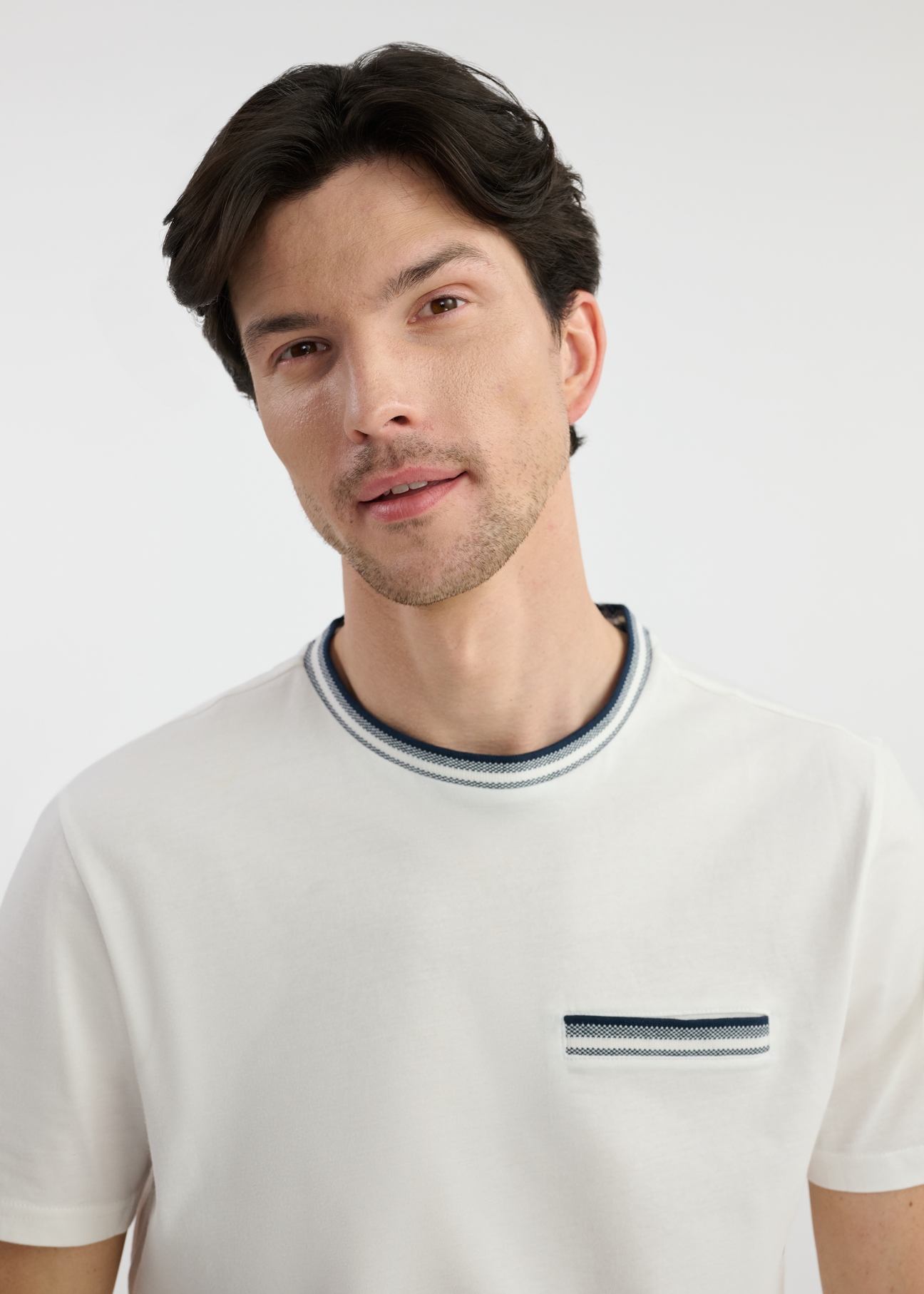 Men's white cotton T-shirt TSHMT-0123-12(W25), front view of the product on the model. Upper part of the silhouette visible.