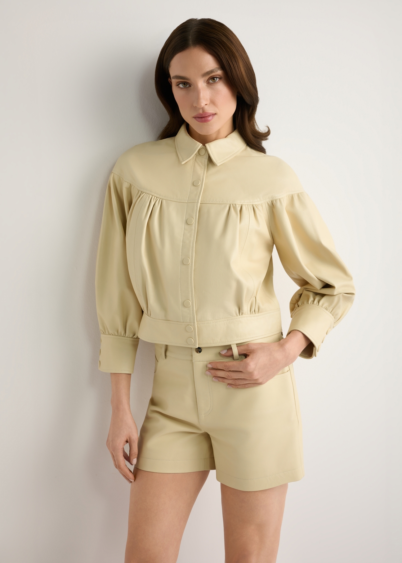 Light yellow leather women's shorts SPODS-0035-2A(W26), front view of the product on the model, half of the silhouette visible.-02