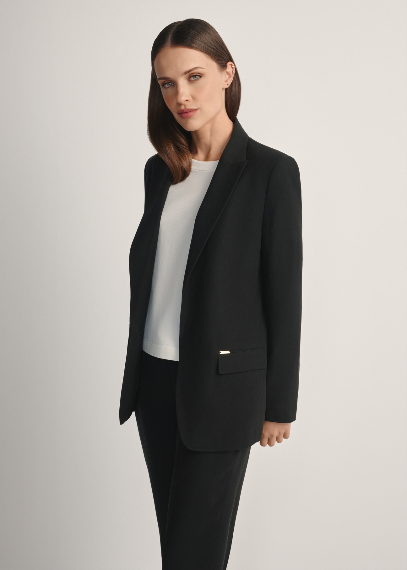 Women's black blazer ZAKDT-0031A-99(W26), front view of the product on the model. Half of the silhouette visible.