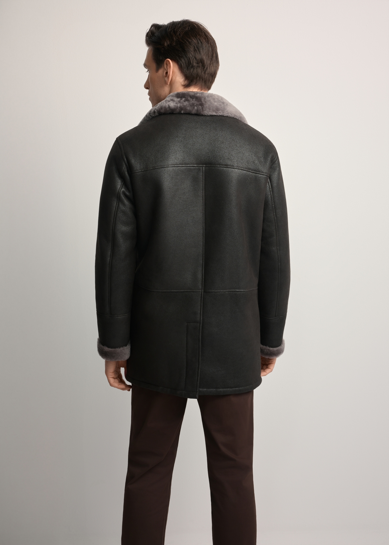Men's brown sheepskin coat KOZMS-0027-4314(Z25), product view from the back on the model. Half of the silhouette visible.