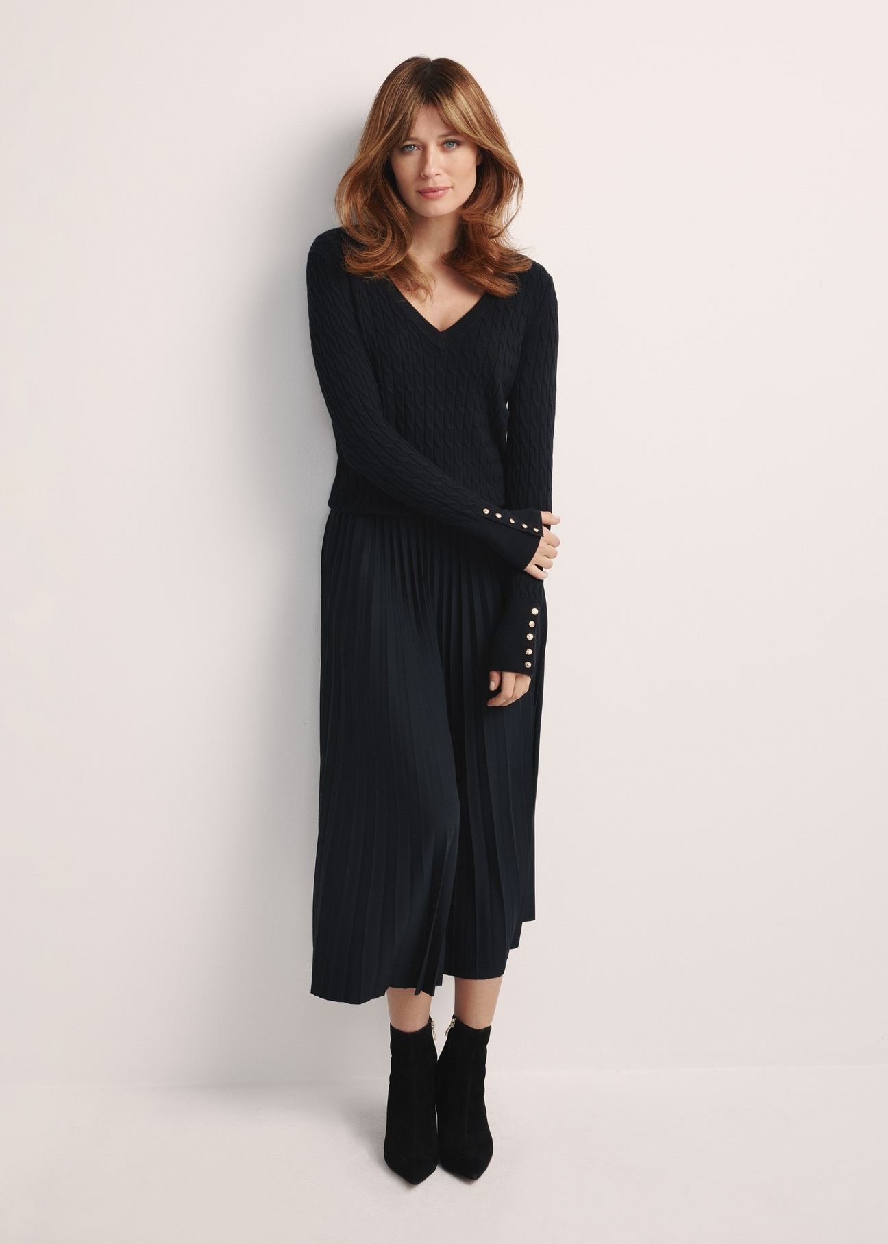 Black women's sweater SWEDT-0212A-99(Z25), product visible from the front on the model, the entire silhouette is visible.