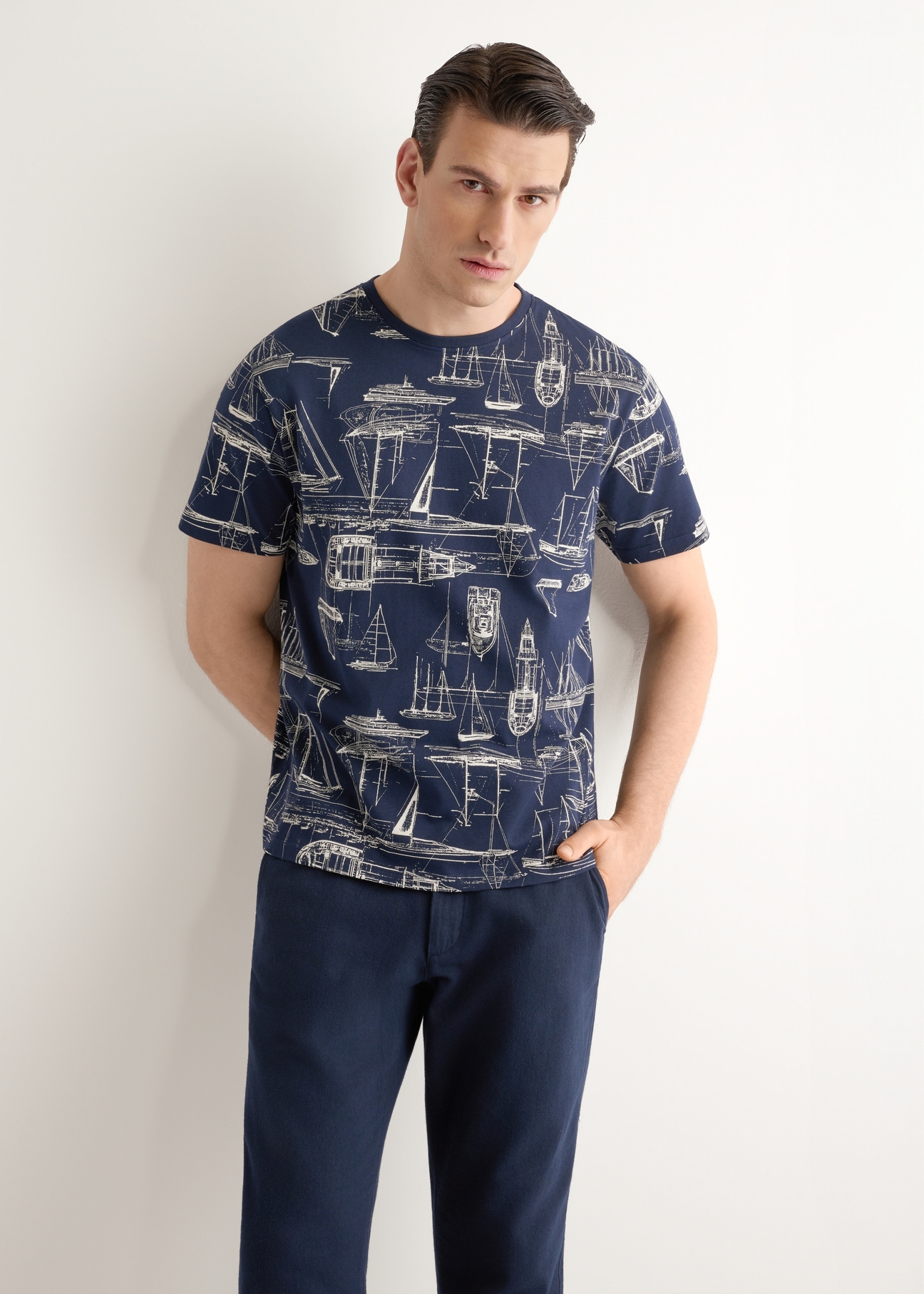 Men's navy graphic t-shirt TSHMT-0148-7E(W26), front view of the product on the model. Half of the silhouette visible.