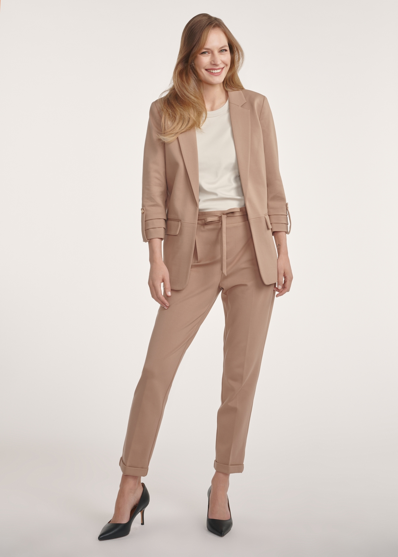Women's camel trousers with a crease SPODT-0098-24(Z24), product view from the front on the model, the entire silhouette is visible.