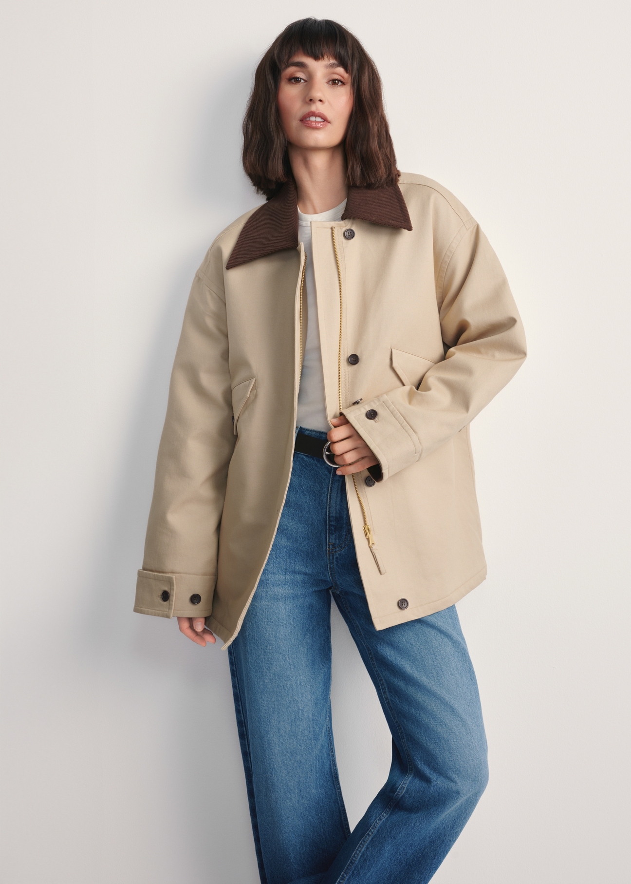 Beige women's oversize jacket KURDT-0615-81(Z25), front view of the product on the model. Half of the silhouette visible.