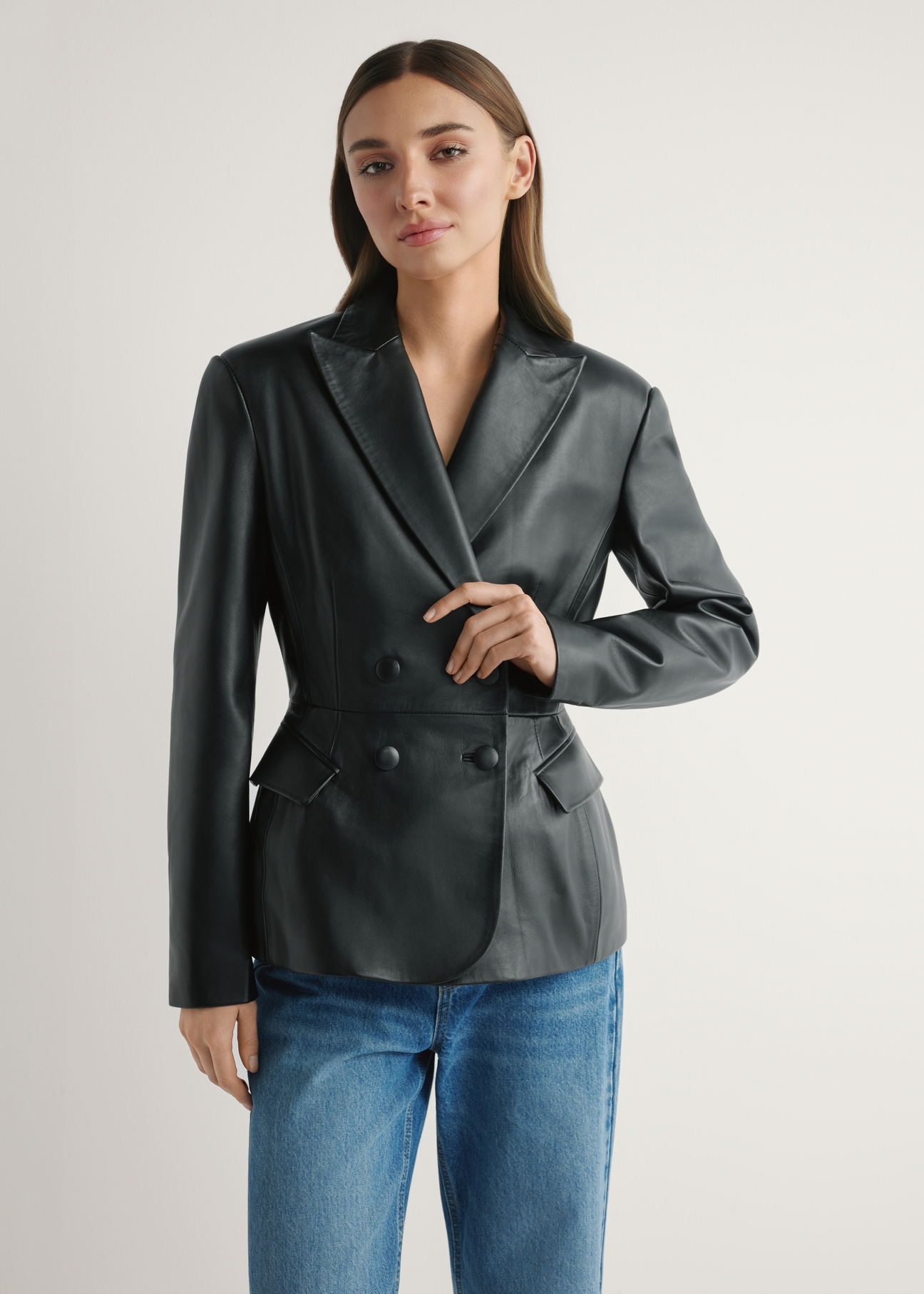 Women's black leather jacket KURDS-0600-99(W26) - front view of the product, on a model, on a light background.