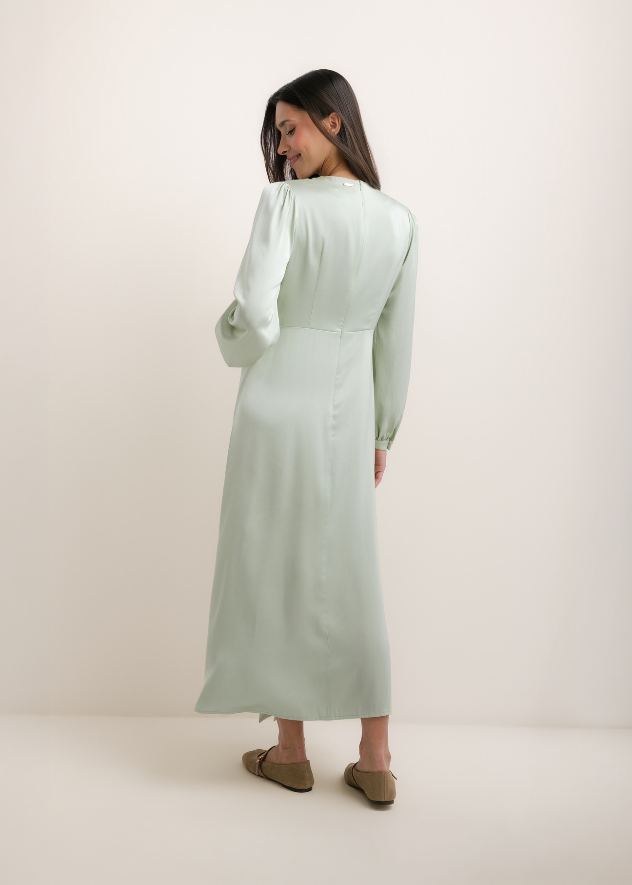 Sage midi dress SUKDT-0263-8F(W26), product view from the back on the model. Full silhouette visible.