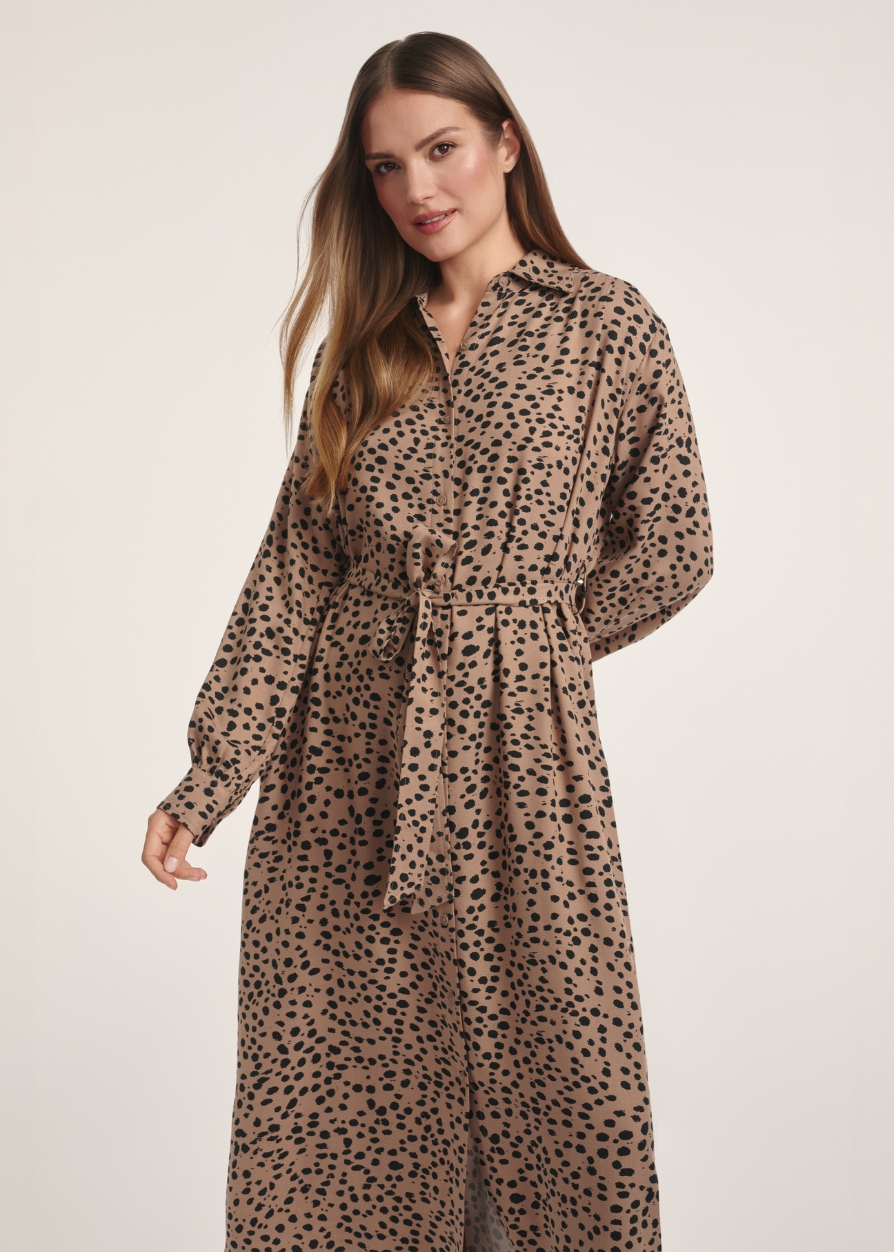 Dark beige long women's dress with spots SUKDT-0247-24(Z25), front view of the product on the model. Half of the silhouette visible.