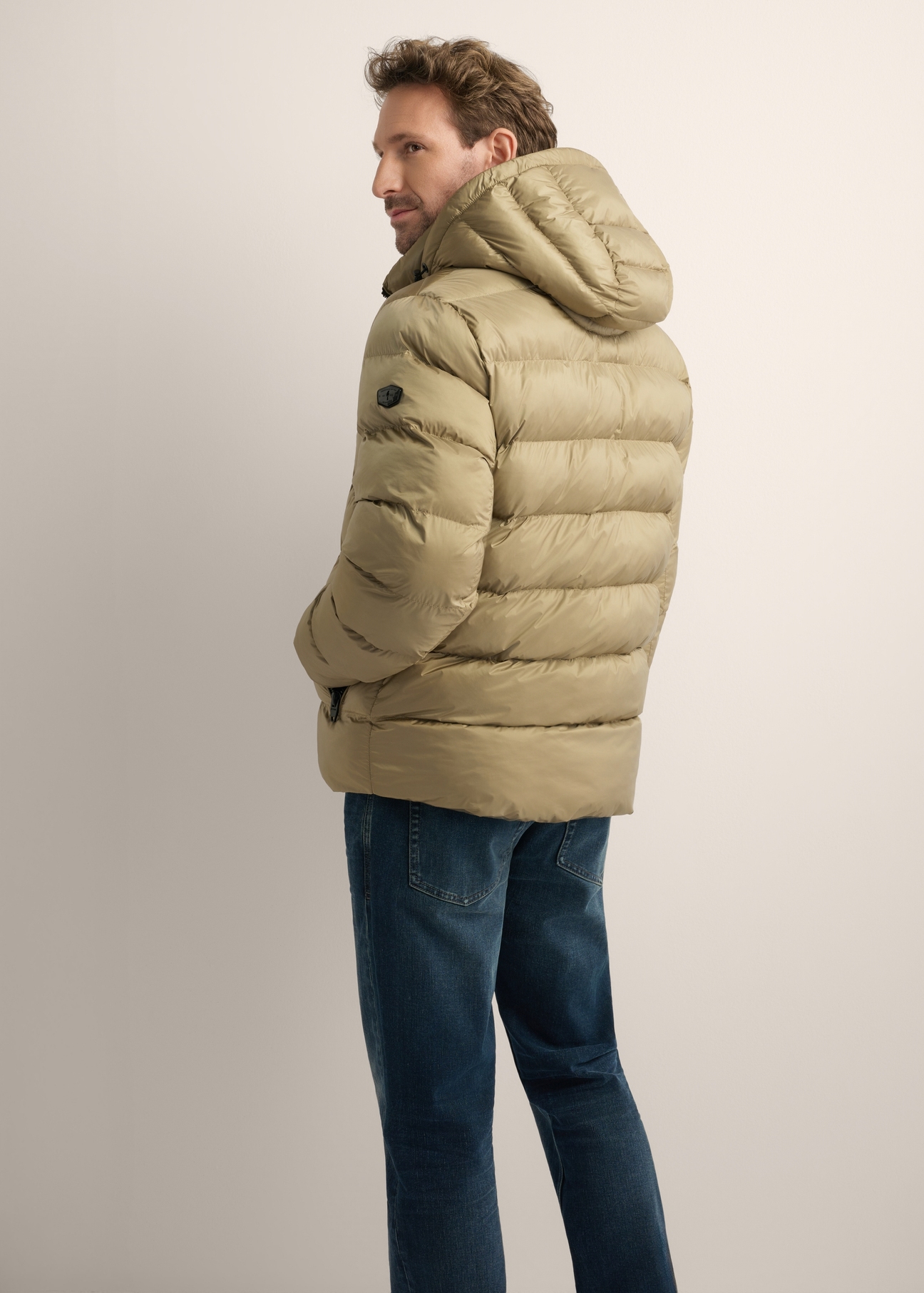 Men's winter jacket in sage color KURMT-0422-8F(Z26), product view from the back on the model. Half of the silhouette visible.