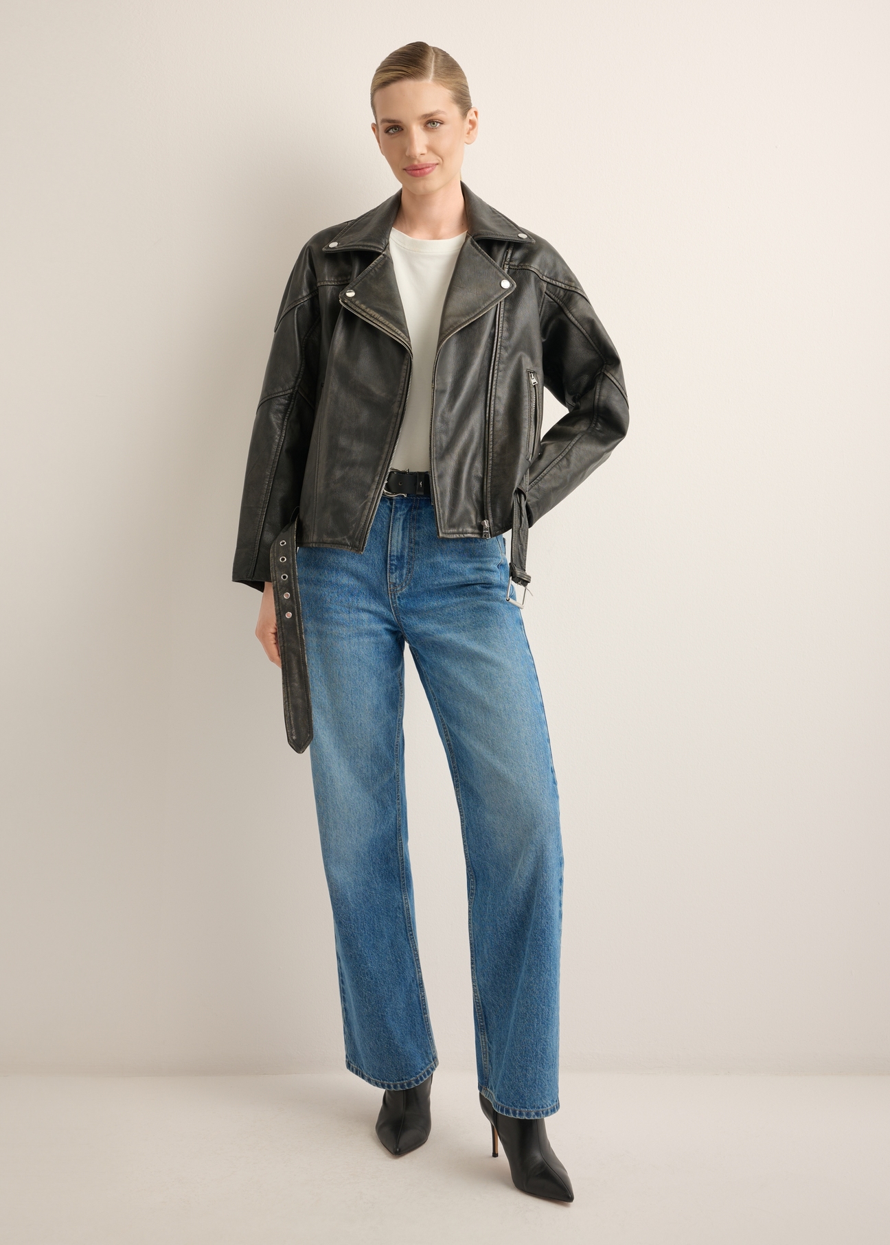 Women's leather biker jacket KURDS-0605-99(W26), front view of the product on a model. Full body visible.