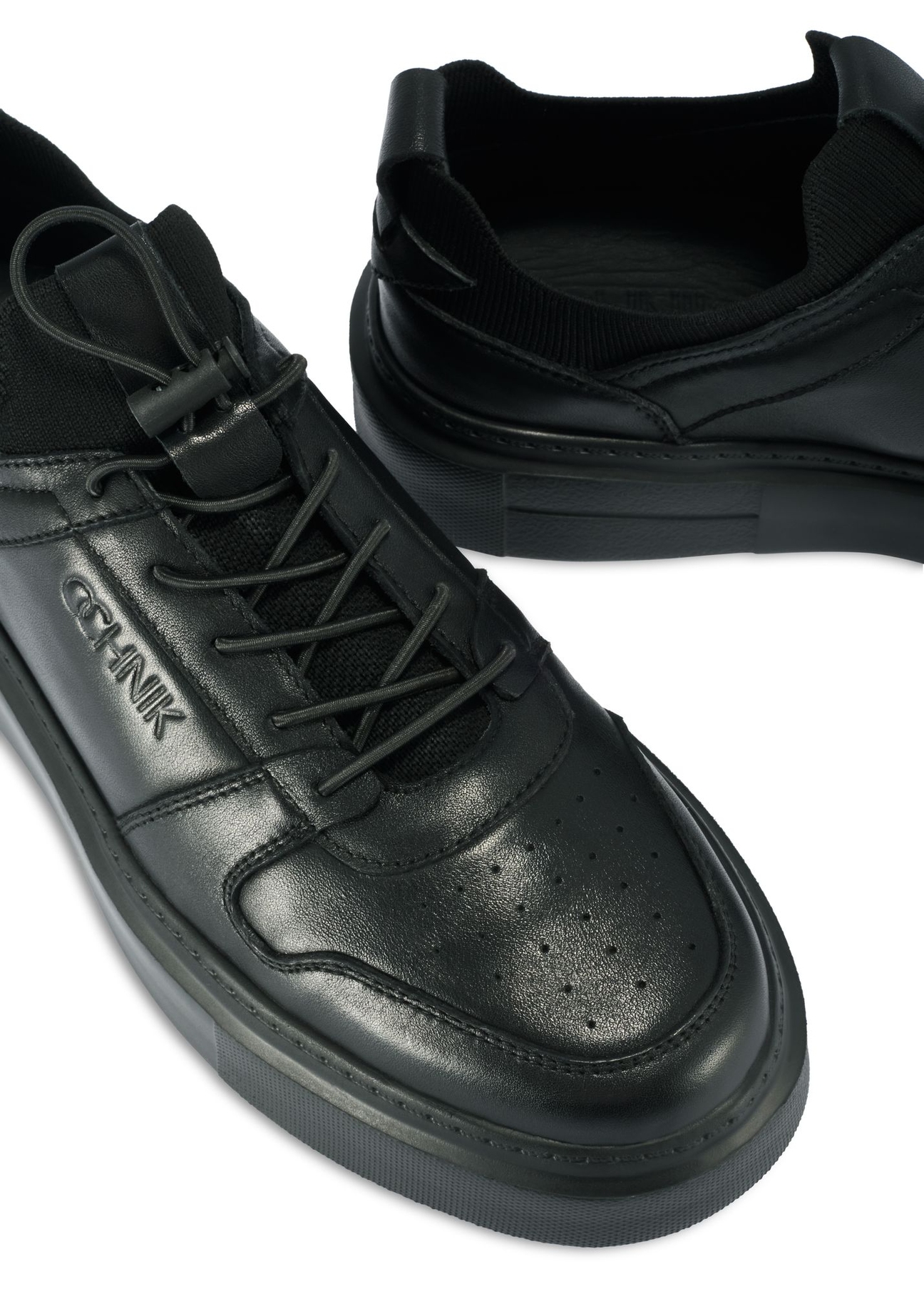 Black men's leather sneakers BUTYM-0509-99(Z25) - close-up of the detail on a white background.