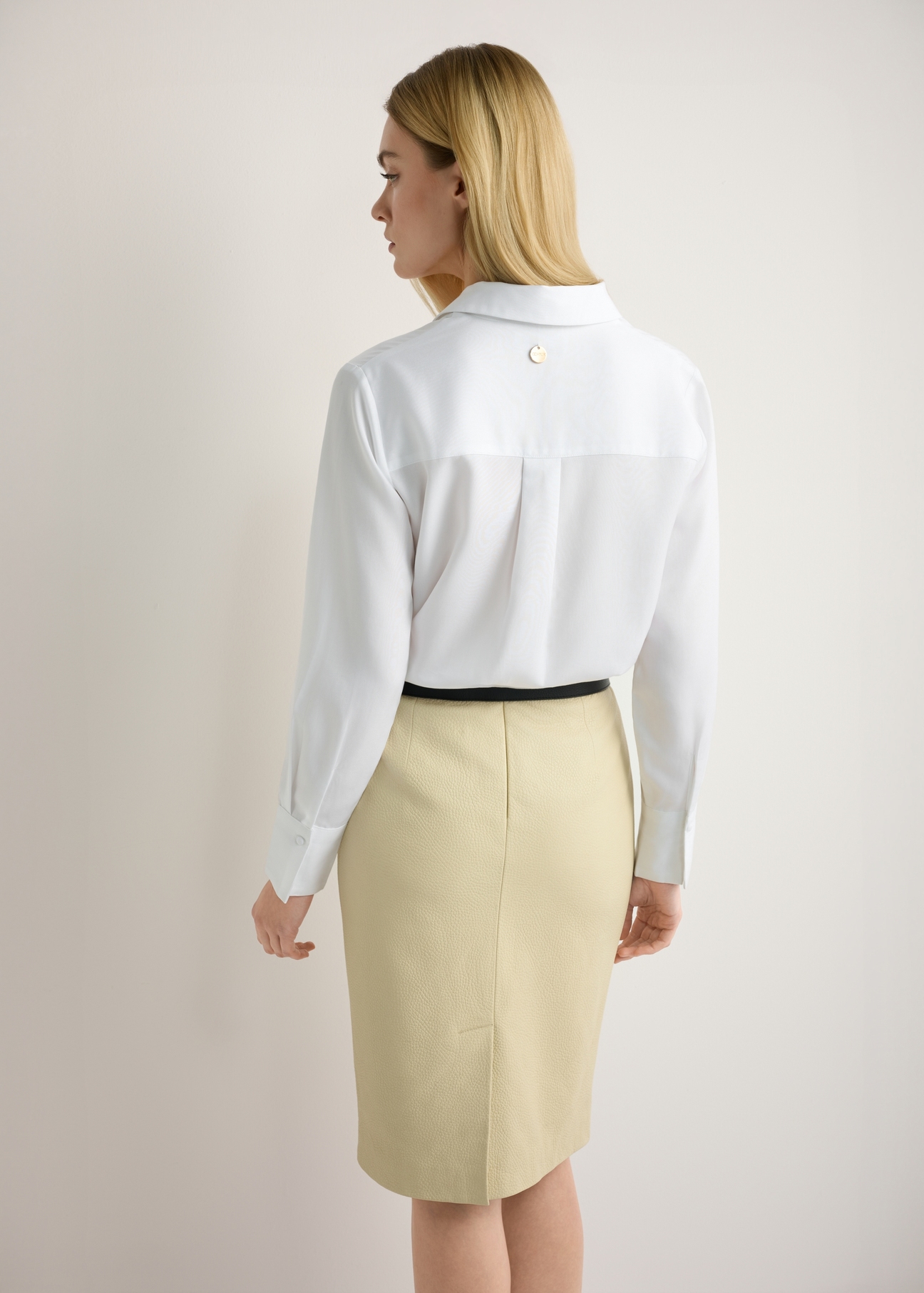 Women's white shirt KOSDT-0182-0A(W26), back view of the product on the model. Half of the silhouette visible.