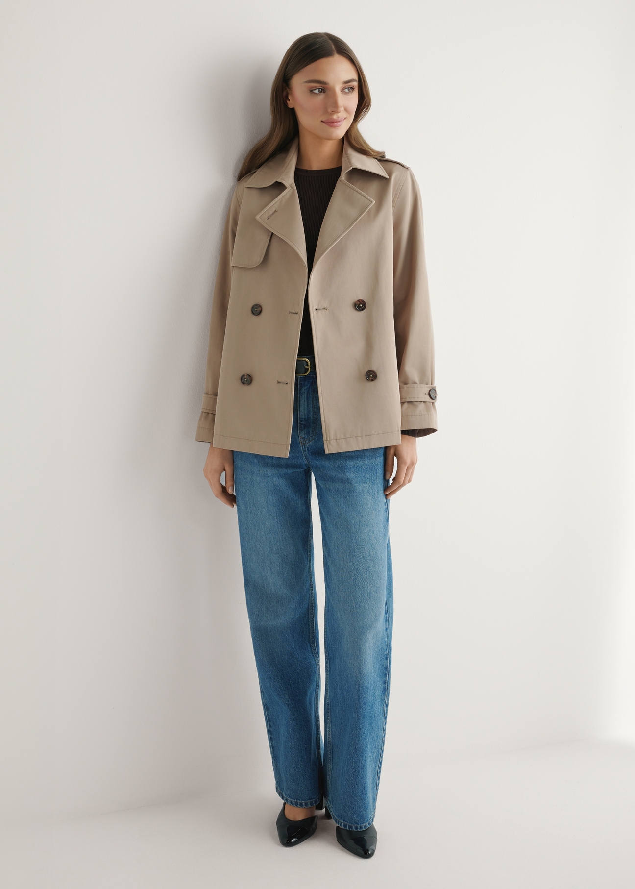 Beige women's short jacket KURDT-0556-1C(W26), front view of the product on the model. Full body visible.