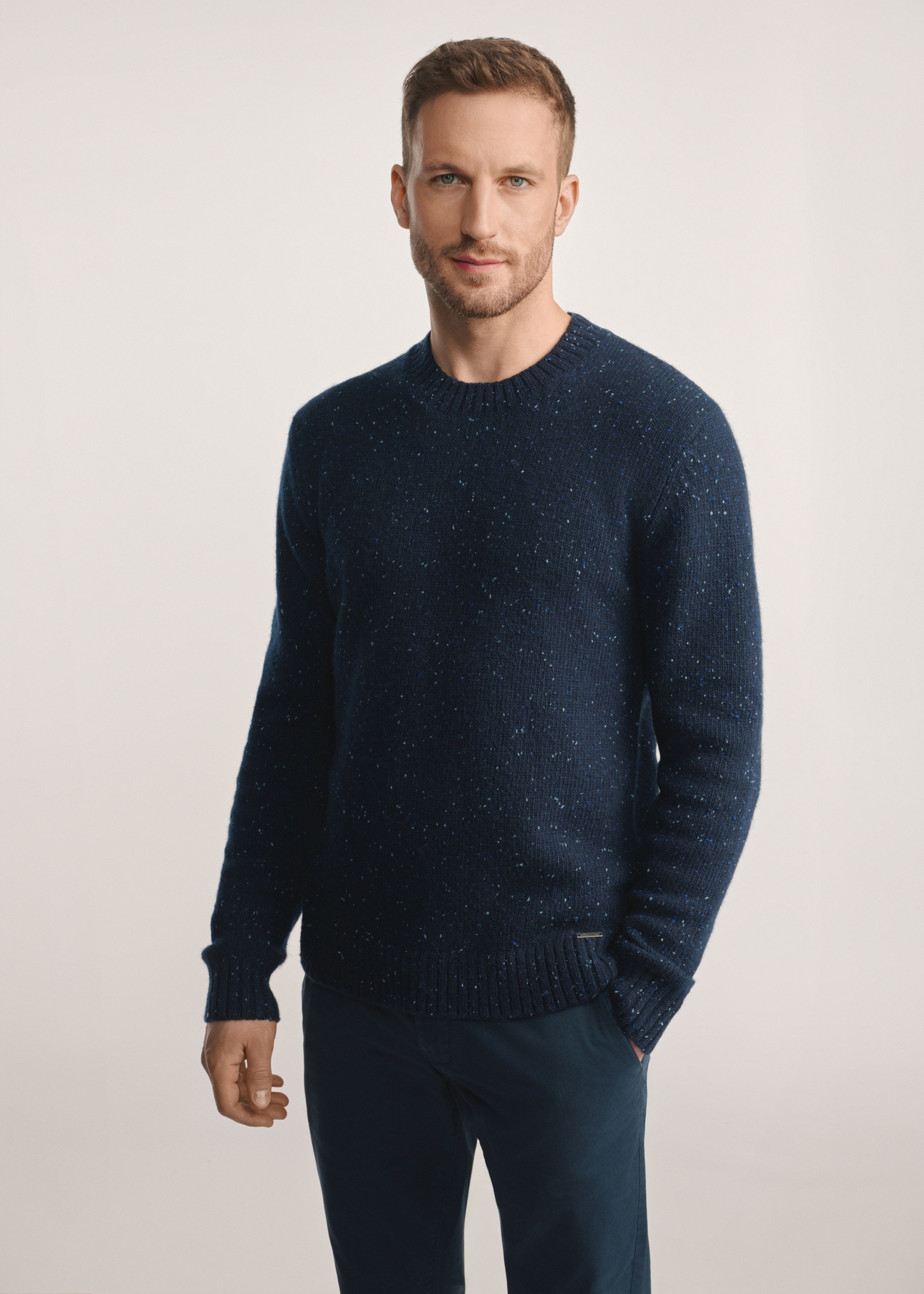Navy blue men's wool sweater SWEMT-0173-7E(Z26), front product view on the model, the entire silhouette is visible.