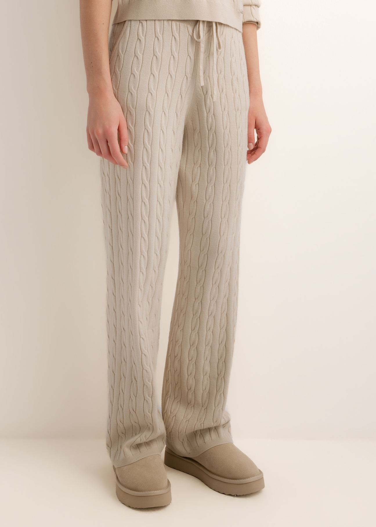 Light beige women's trousers SPODT-0131-1A(Z26), front view on a model. Half-body shot.